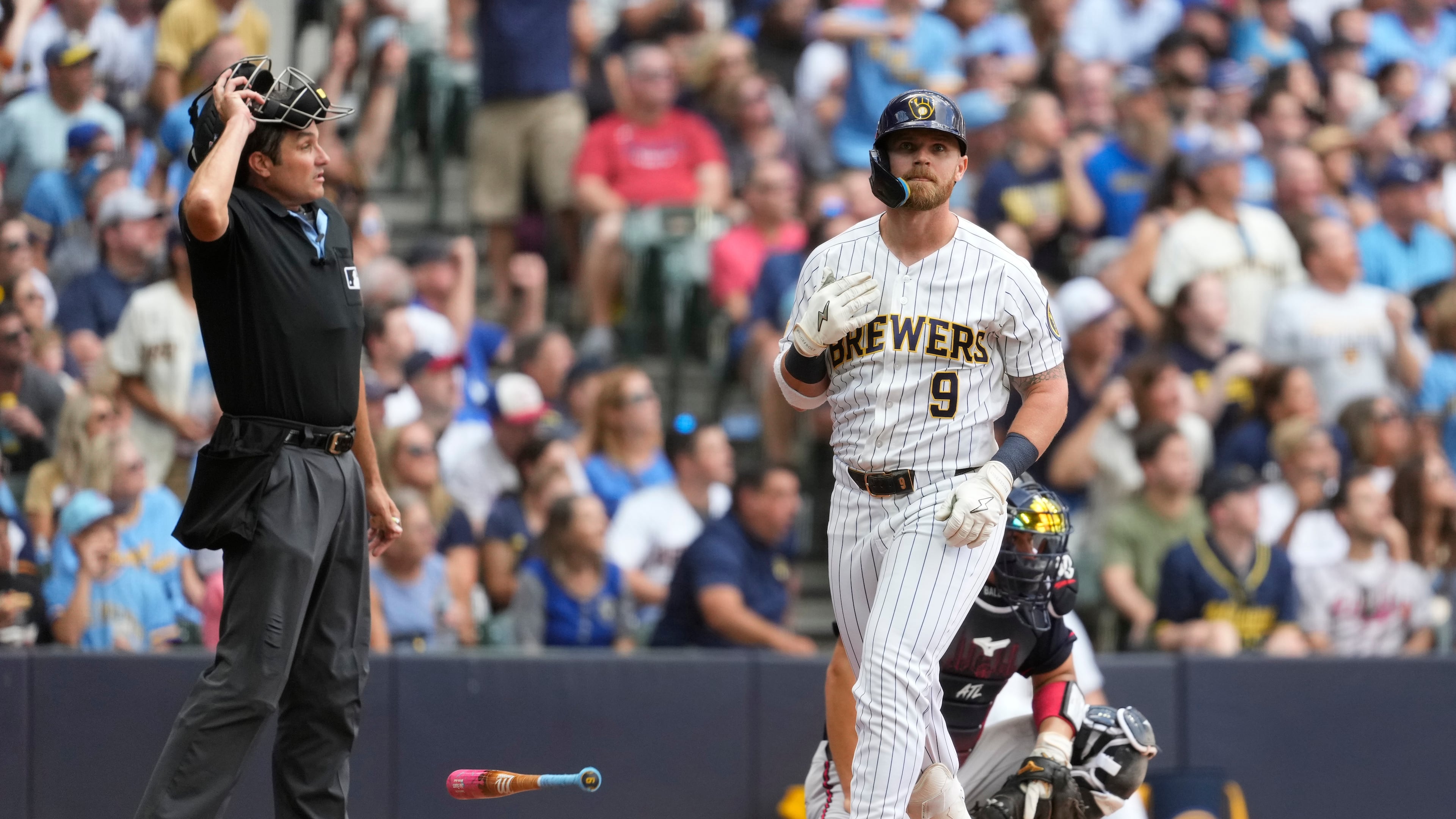 Milwaukee Brewers' Jake Bauers flips his bat after hitting a two-run home run during the third inning of a baseball game against the Atlanta Braves, Saturday, Aug. 22, 2026, in Milwaukee. (AP Photo/Aaron Gash)