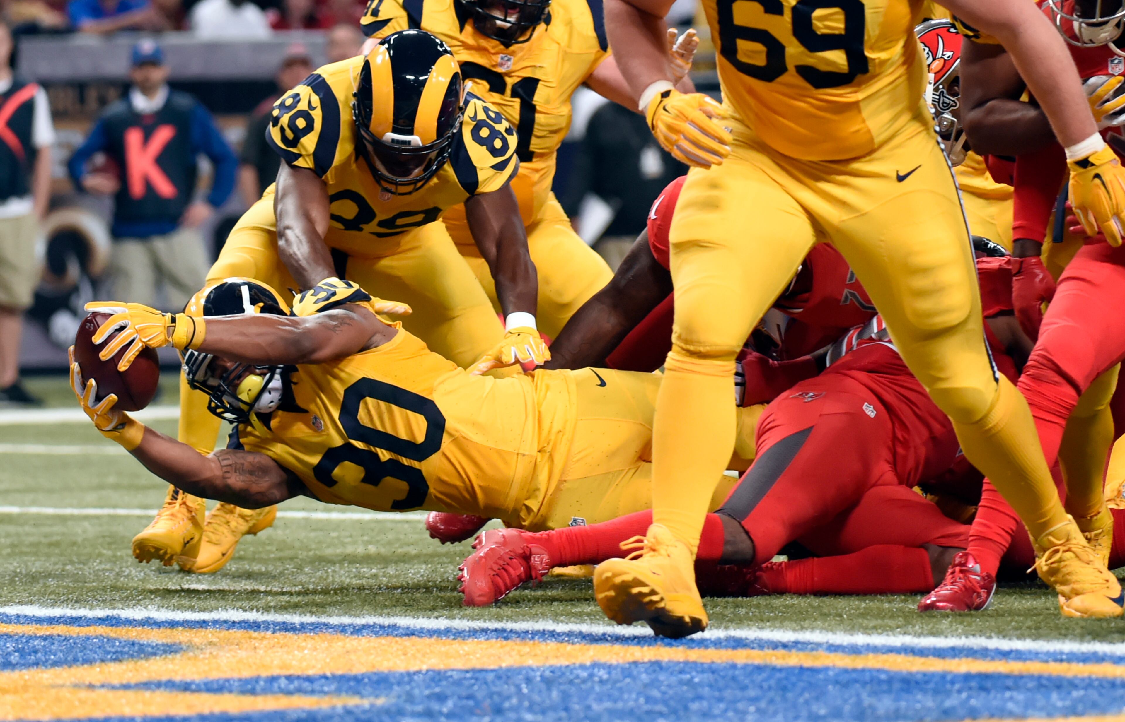 St. Louis Rams running back Todd Gurley scores on a 3-yard run during the second quarter of an NFL football game against the Tampa Bay Buccaneers on Thursday, Dec. 17, 2015, in St. Louis. (AP Photo/L.G. Patterson)