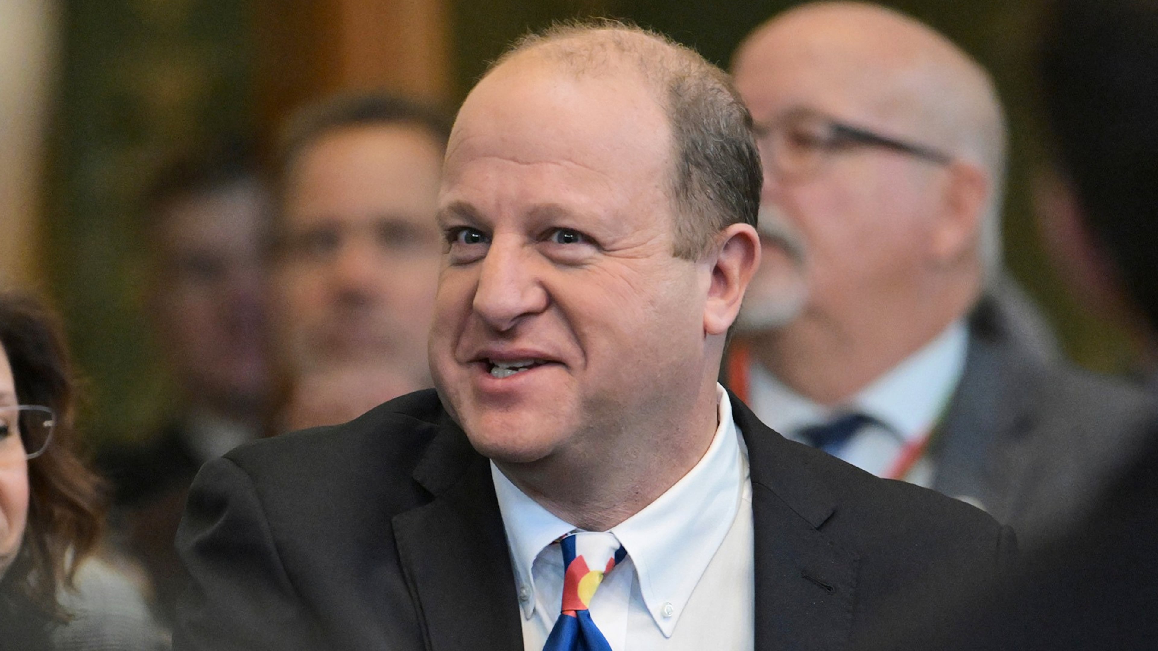 FILE - Colorado Gov. Jared Polis arrives in the House chamber of the Colorado State Capitol to deliver his state of the state address, Thursday, Jan. 9, 2025, in Denver. (Hyoung Chang/The Denver Post via AP, Pool, File)