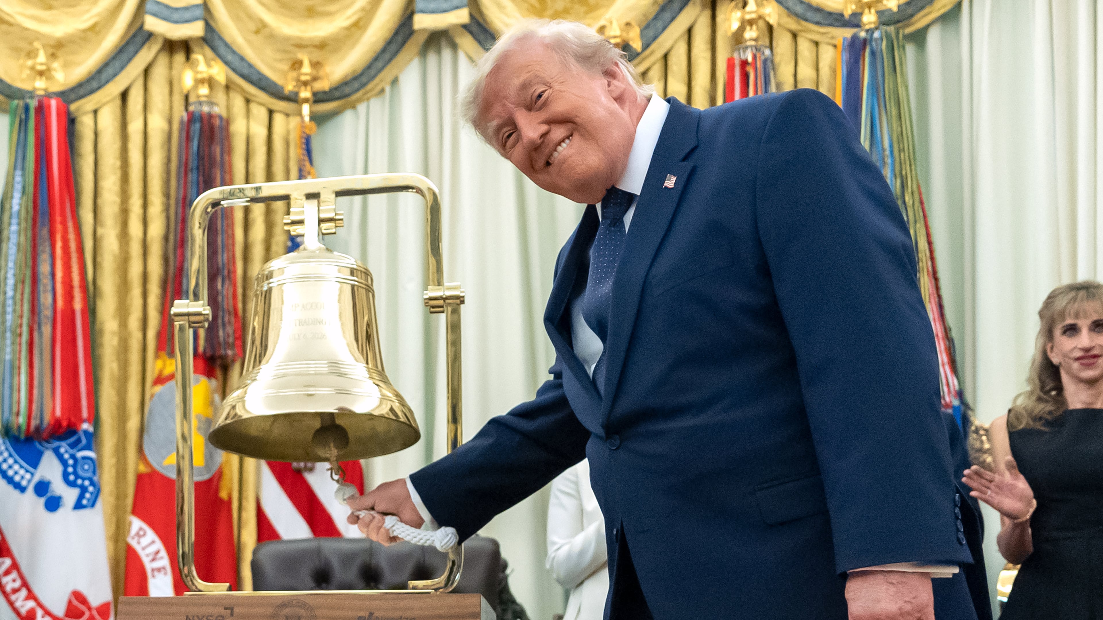 President Donald Trump rings the opening bell for the New York Stock Exchange and the Nasdaq in the Oval Office at the White House, Monday, July 6, 2026, in Washington. (AP Photo/Mark Schiefelbein)