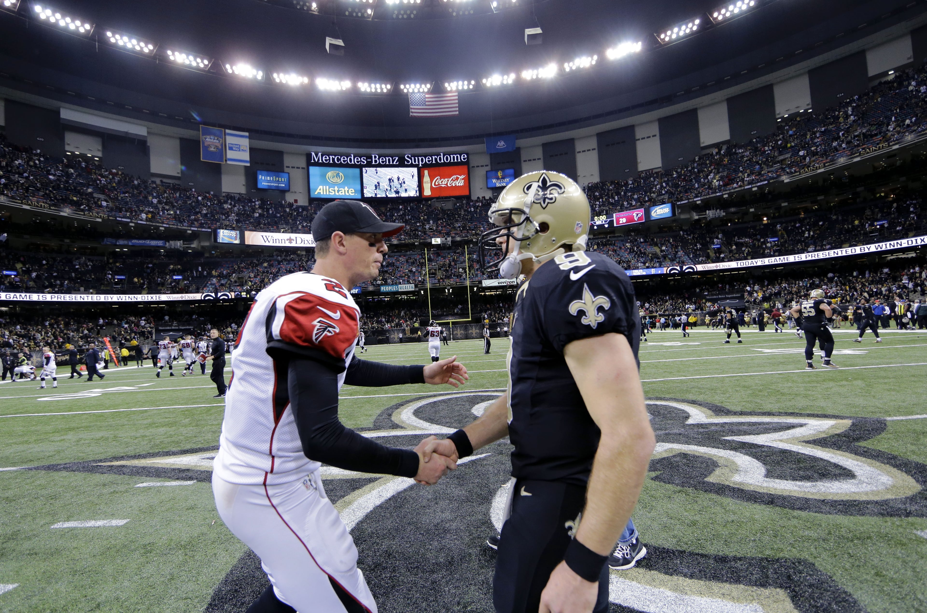 Atlanta Falcons quarterback Matt Ryan (2) shakes hands with New Orleans Saints quarterback Drew Brees (9) after their NFL football game in New Orleans, Sunday, Dec. 21, 2014. The Falcons won 30-14. (AP Photo/Bill Haber)