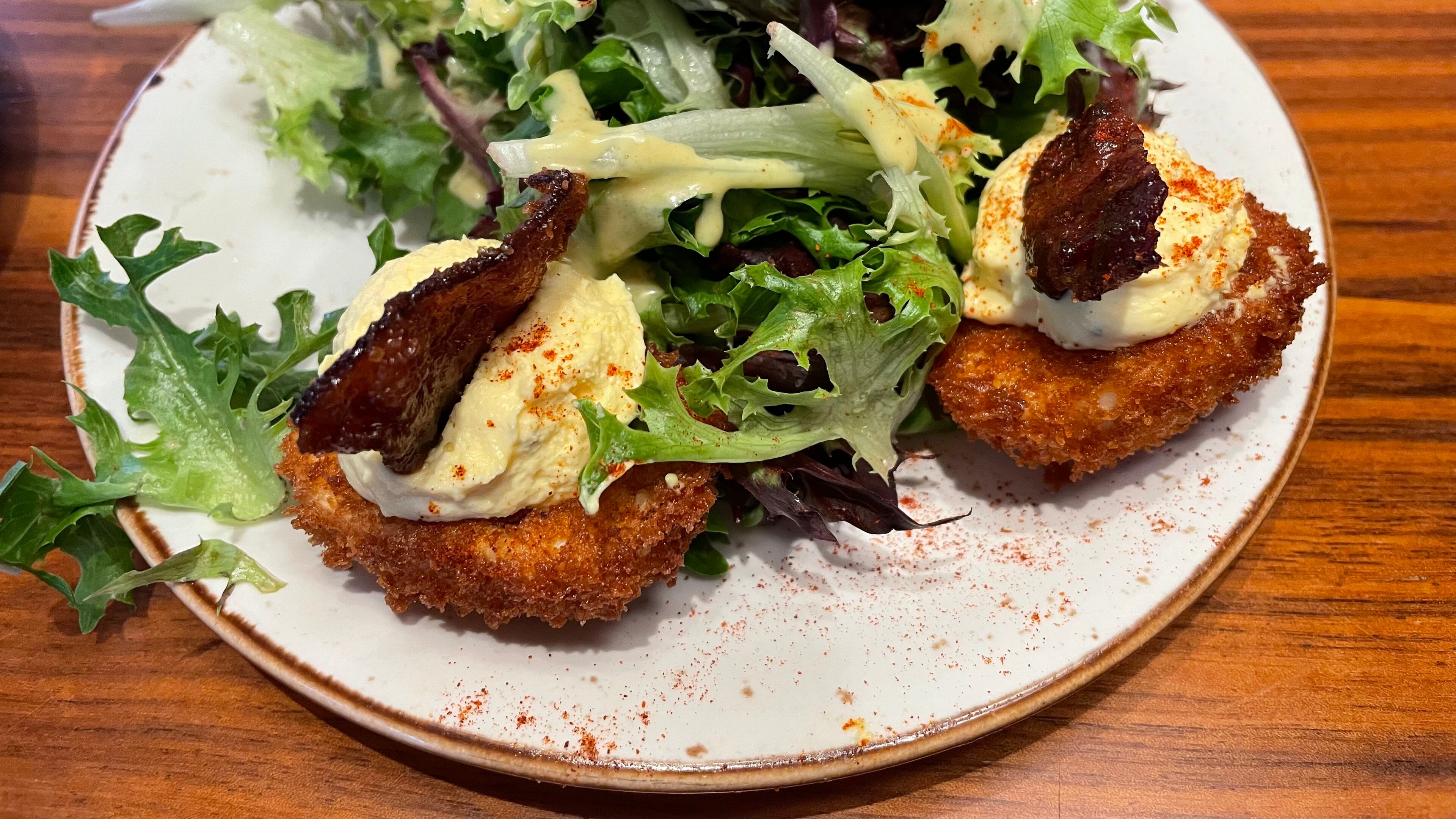 The deviled eggs at Lazy Dog have their whites breaded and fried. Angela Hansberger for The Atlanta Journal-Constitution