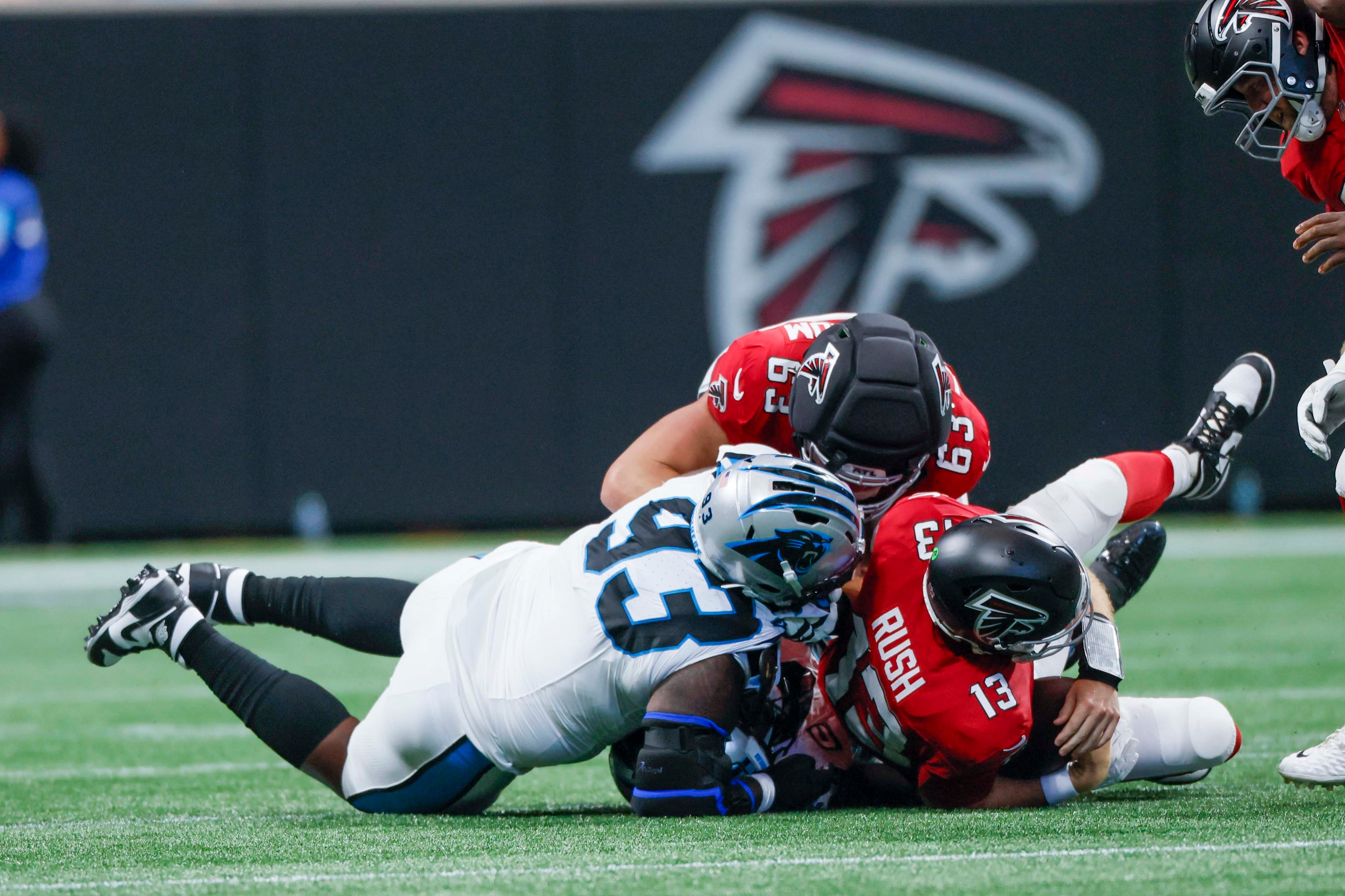 Atlanta Falcons quarterback Cooper Rush (13) is sacked by Carolina Panthers defensive tackle Terah Edwards (93) in the first half of an NFL game at Mercedes-Benz Stadium in Atlanta on Sunday, September 20, 2026.
(Miguel Martinez/AJC)