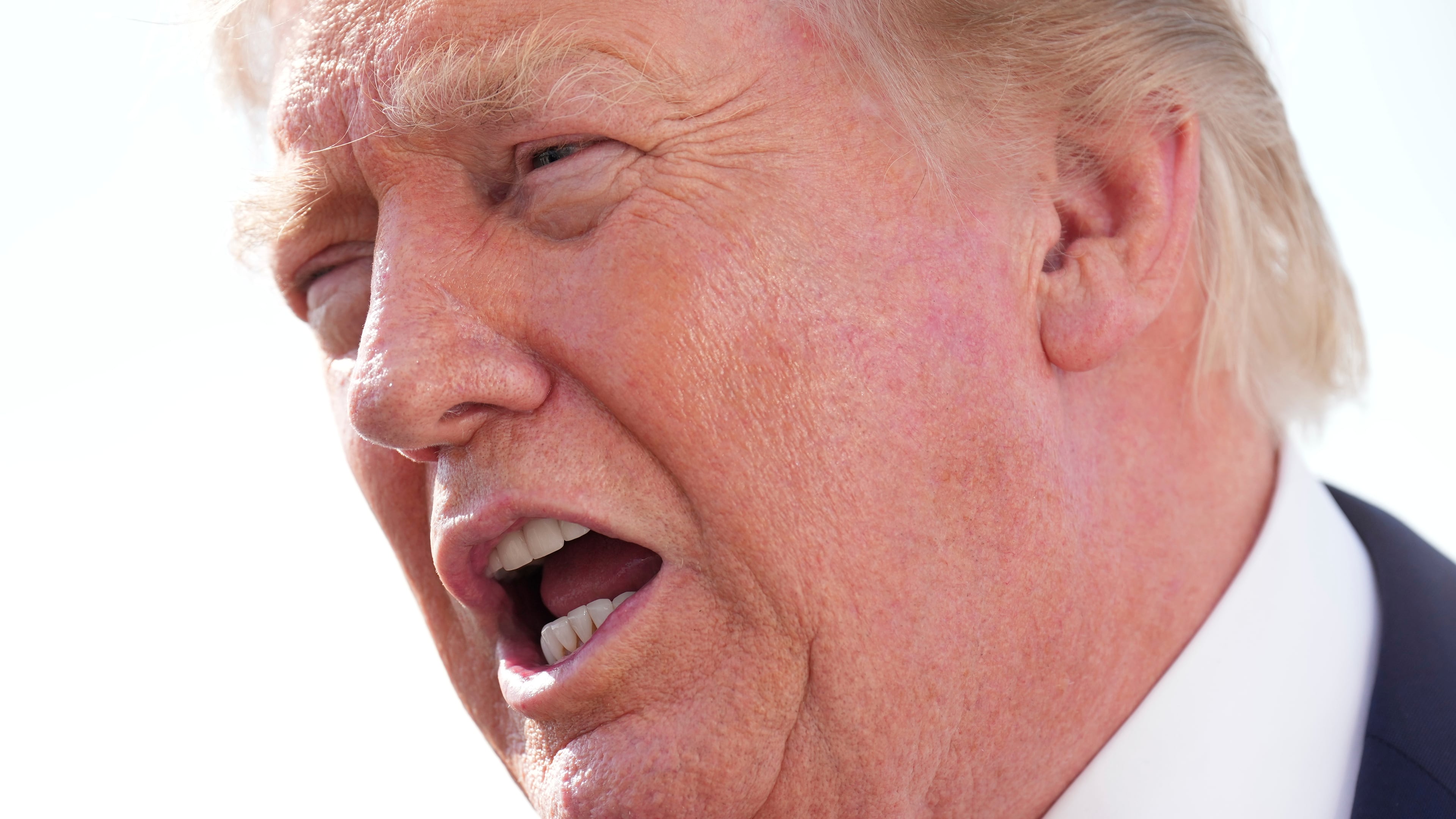 President Donald Trump speaks with reporters before boarding Air Force One, Friday, Aug. 21, 2026, at Joint Base Andrews, Md., en route to South Carolina. (AP Photo/Jacquelyn Martin)