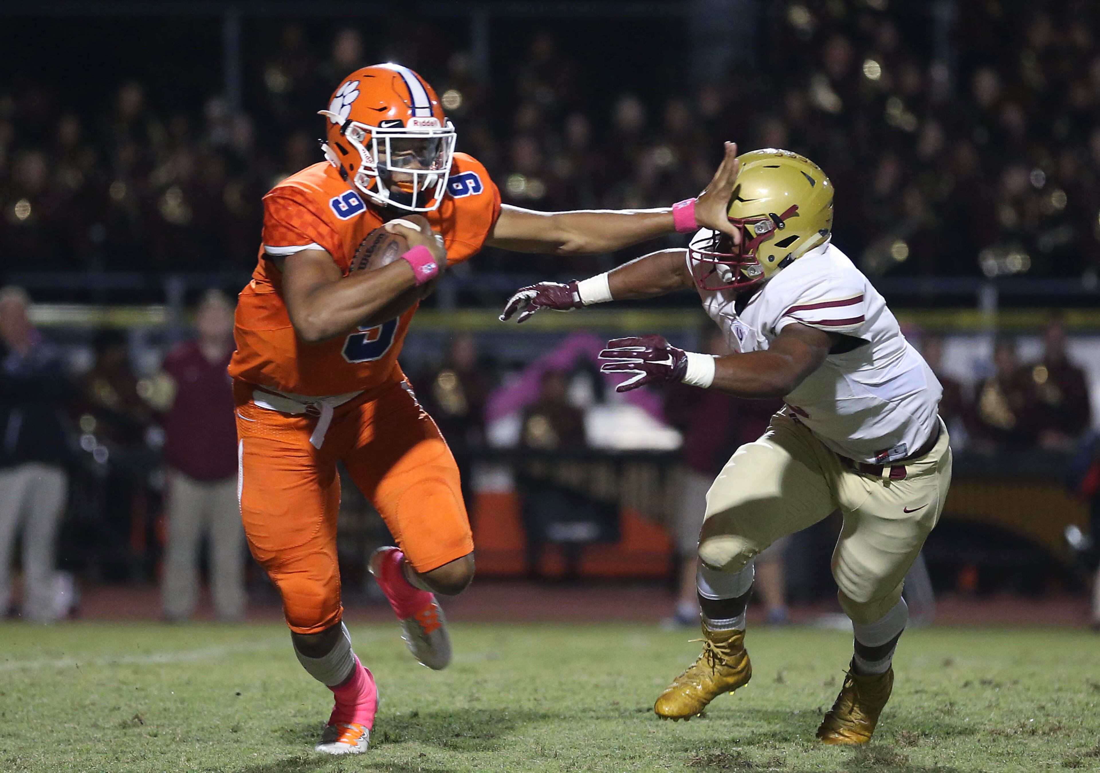October 20, 2017 - Lilburn, Ga: Parkview quarterback Fred Payton (9) eludes the tackle of Brookwood linebacker Kareem Bessent (8) in the first half of their game at Parkview High School Friday, October 20, 2017, in Lilburn, Ga.. PHOTO / JASON GETZ