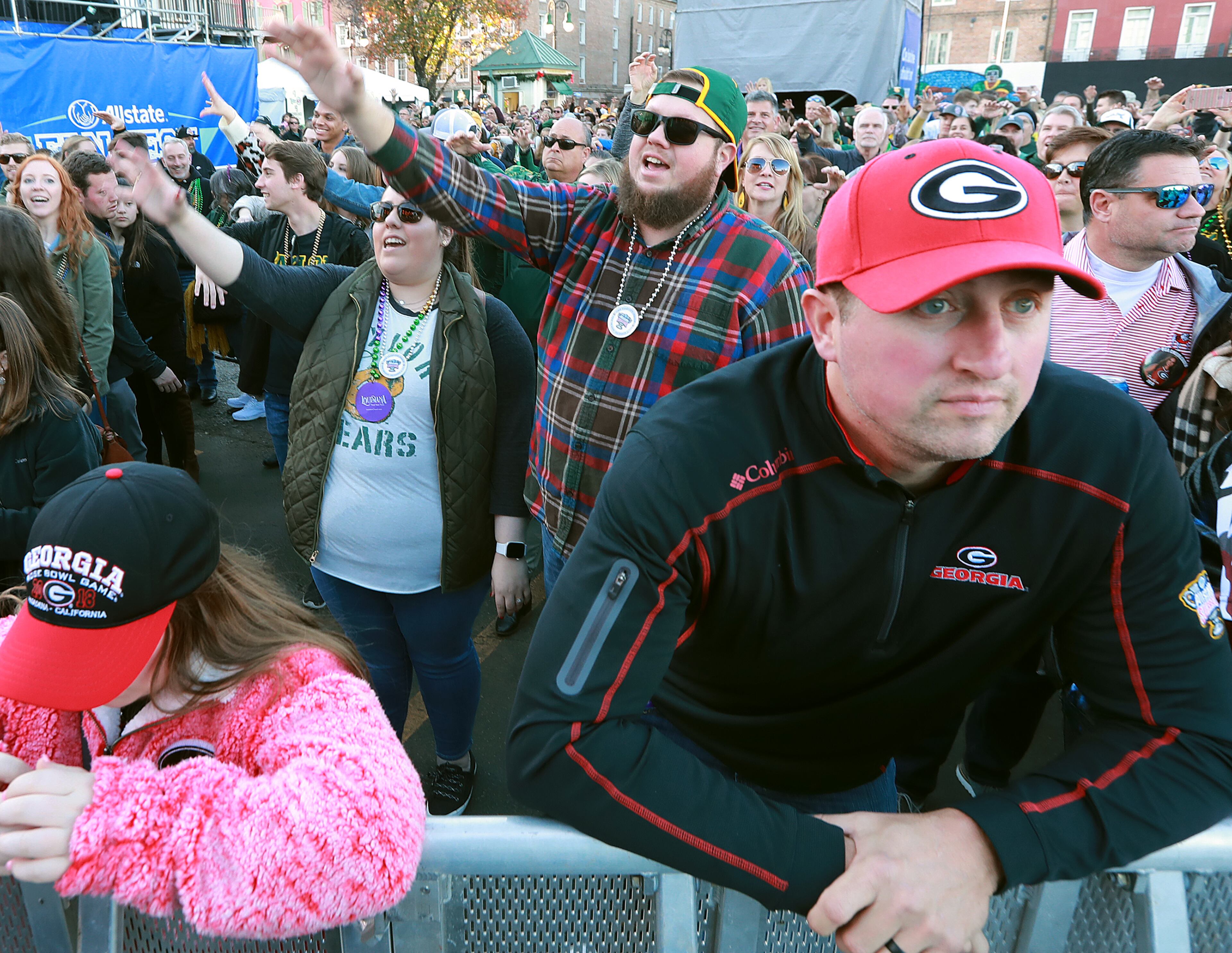 Georgia fan Jason Sutton appears pensive while Baylor fans cheer behind him. Curtis Compton ccompton@ajc.com
