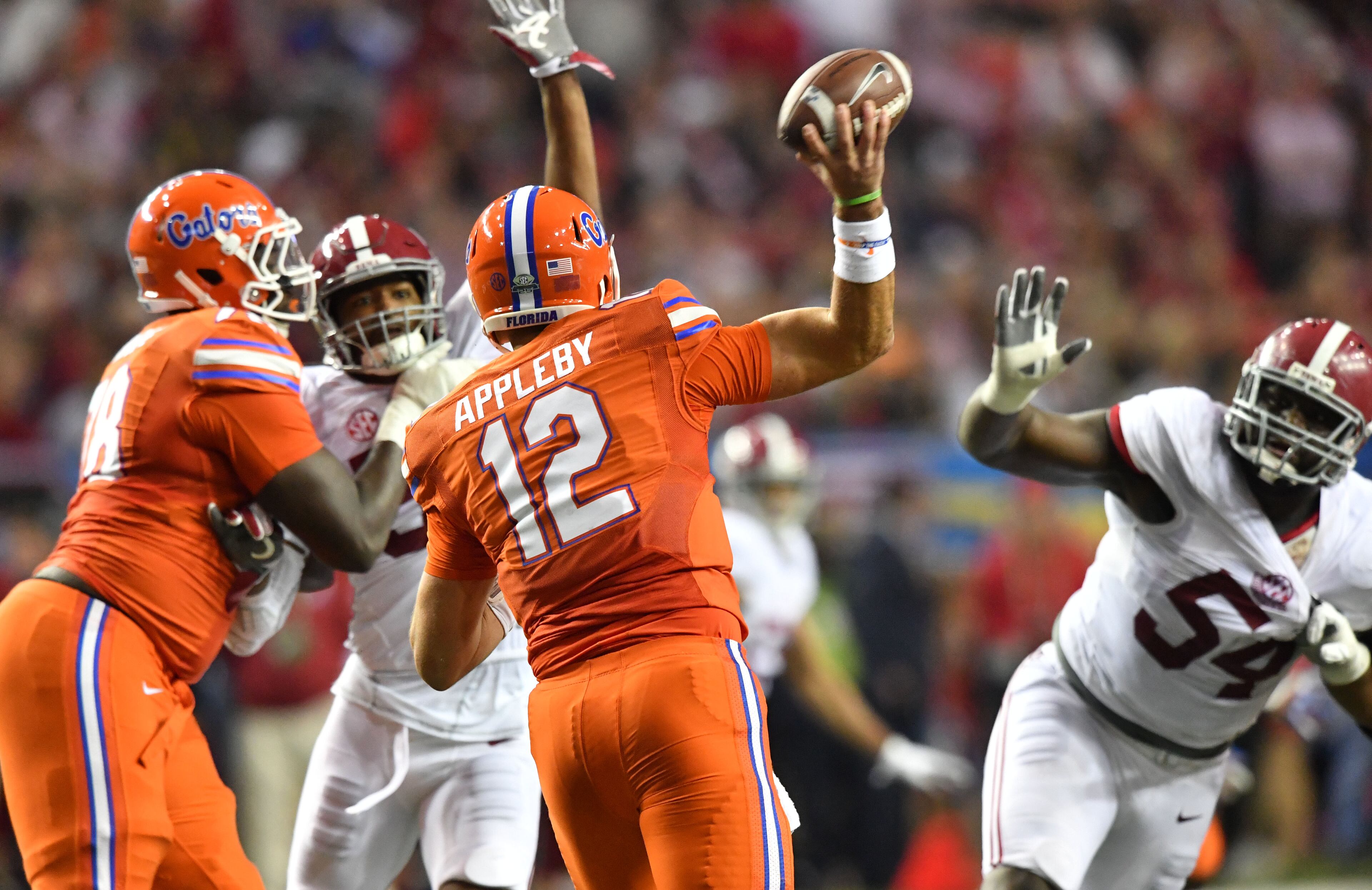 December 3, 2016 Atlanta - Florida quarterback Austin Appleby (12) gets off a pass in the first half of the 2016 SEC Championship at the Georgia Dome on Saturday, December 3, 2016. HYOSUB SHIN / HSHIN@AJC.COM