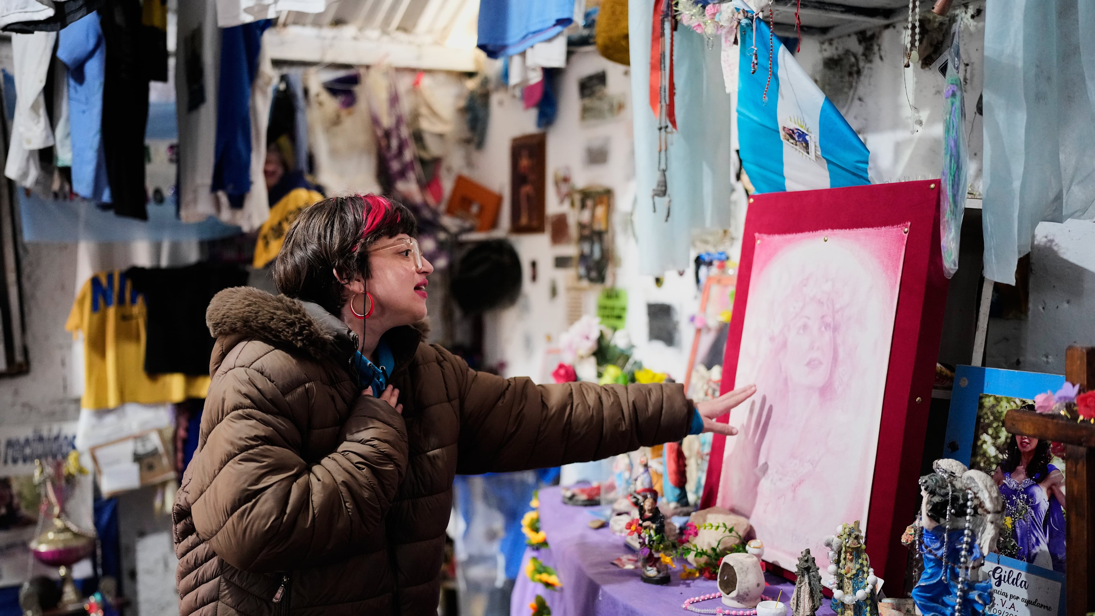 A person prays at a sanctuary dedicated to late Argentine singer Gilda on the 30th anniversary of her death in a bus crash, in Entre Rios, Argentina, Monday, Sept. 7, 2026. (AP Photo/Natacha Pisarenko)