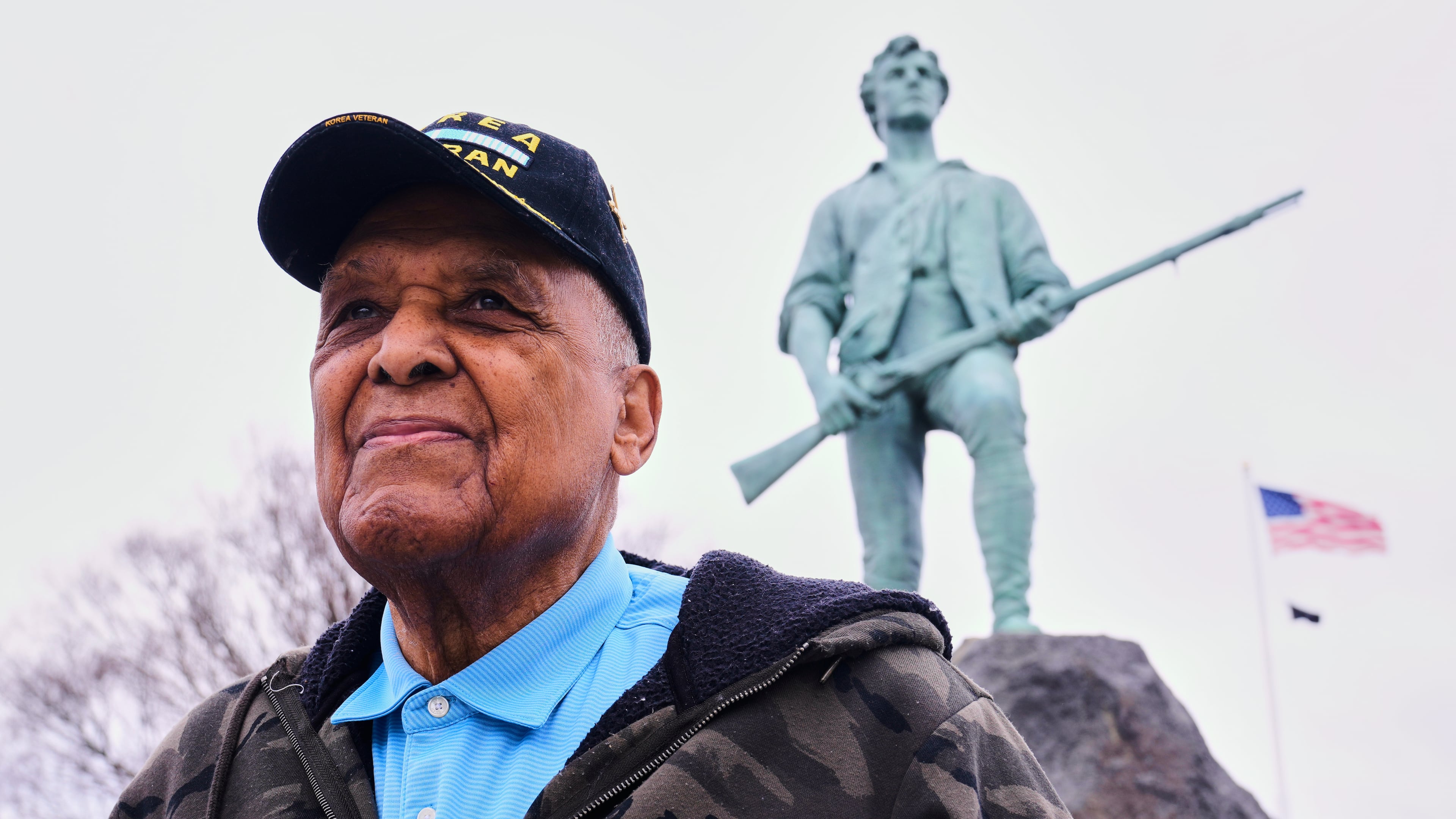 Revolutionary War re-enactor Charles Price, 95, who for decades portrayed enslaved Minuteman Prince Estabrook, poses for a portrait near the Minute Man statue, Monday, April 13, 2026, in Lexington, Mass. (AP Photo/Charles Krupa)