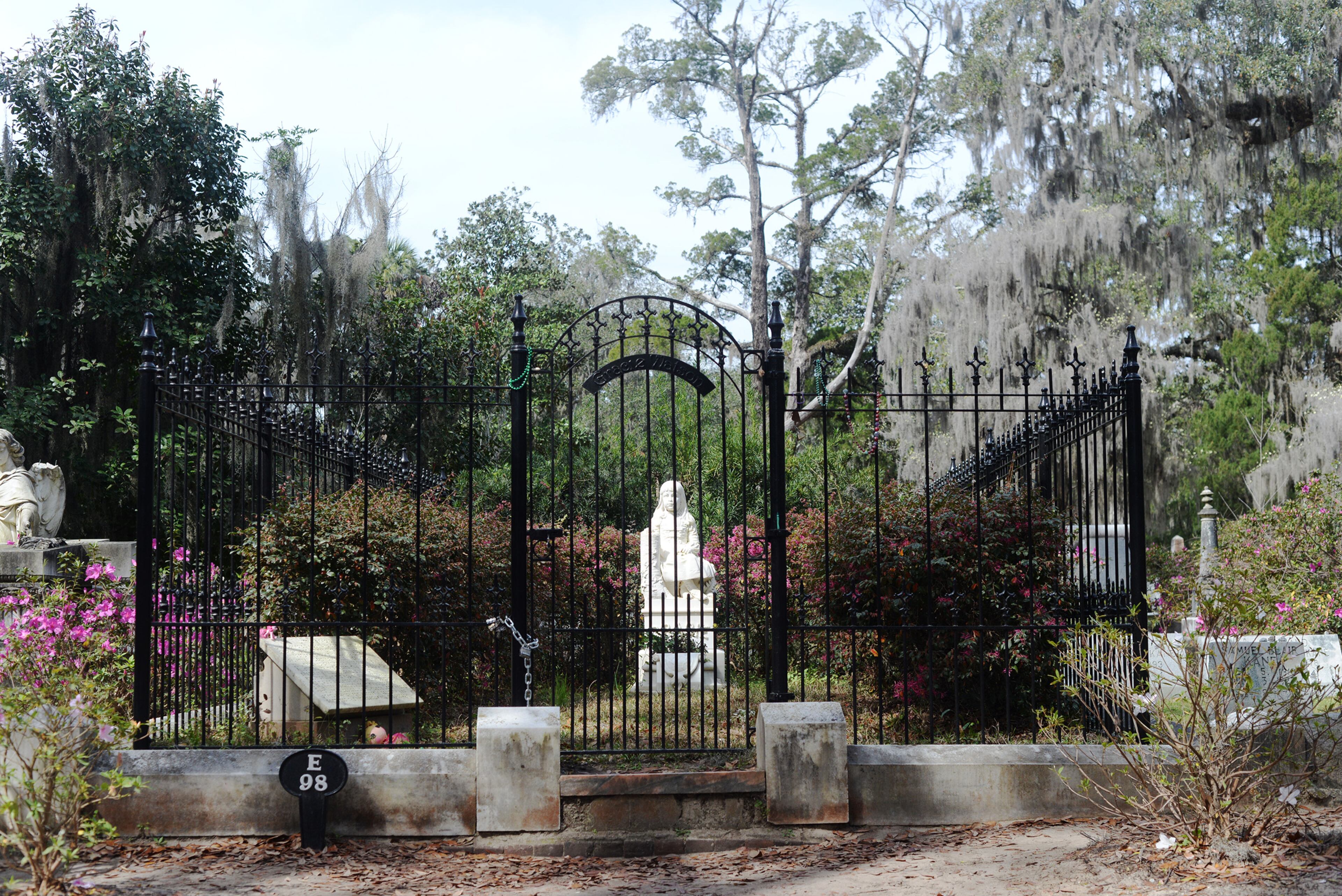 Travelers visit the grave of "Little Gracie," one of the world's most-visited graves, in Bonaventure Cementery in Savannah, Ga. on Friday, March 18, 2016. Gracie Watkins died in Savannah in 1889 after suffering from pneumonia.