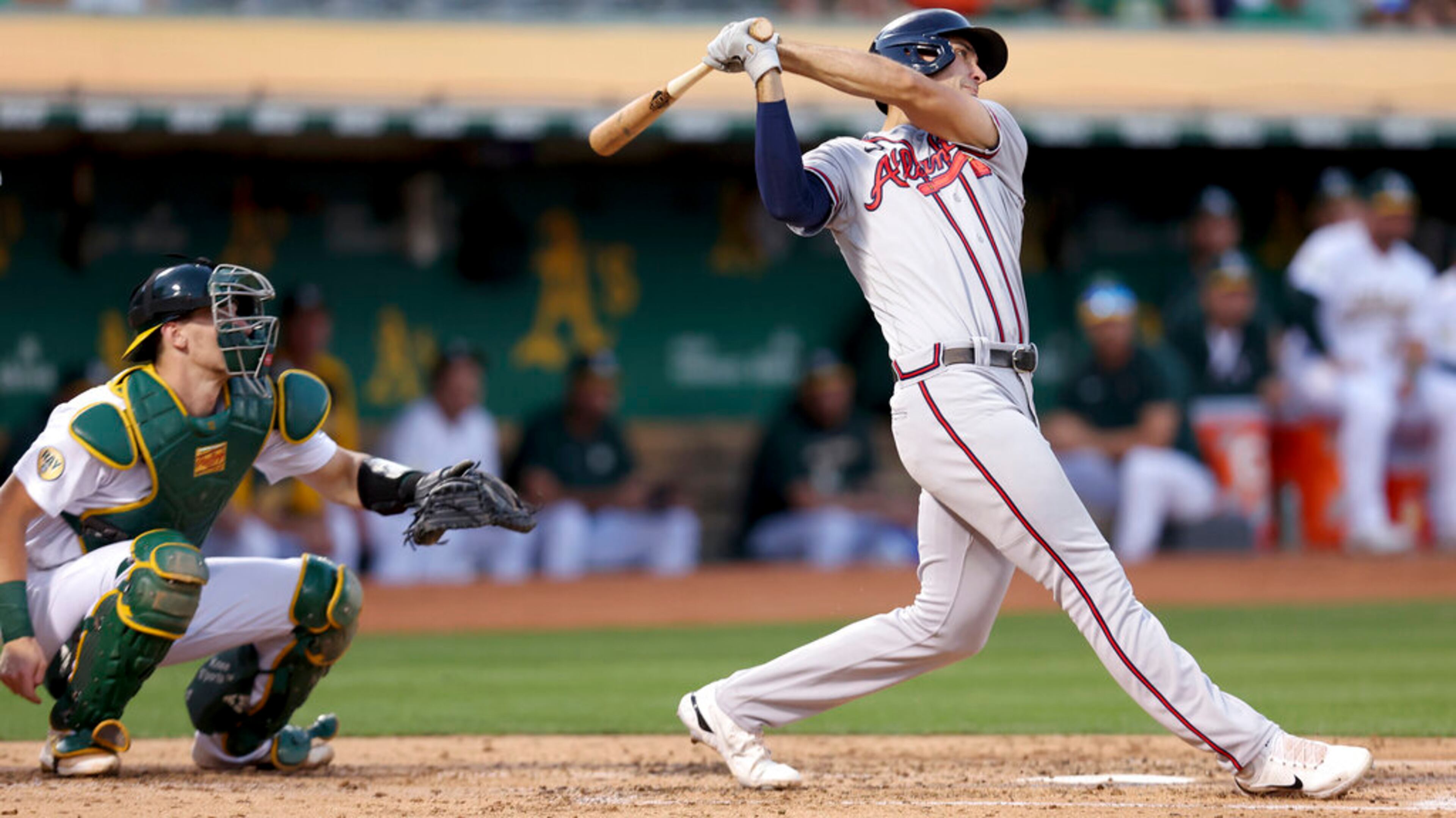 Braves first baseman Matt Olson hits a three-run home run in front of Athletics catcher Sean Murphy during the third inning Tuesday night in Oakland, Calif. (AP Photo/Jed Jacobsohn)