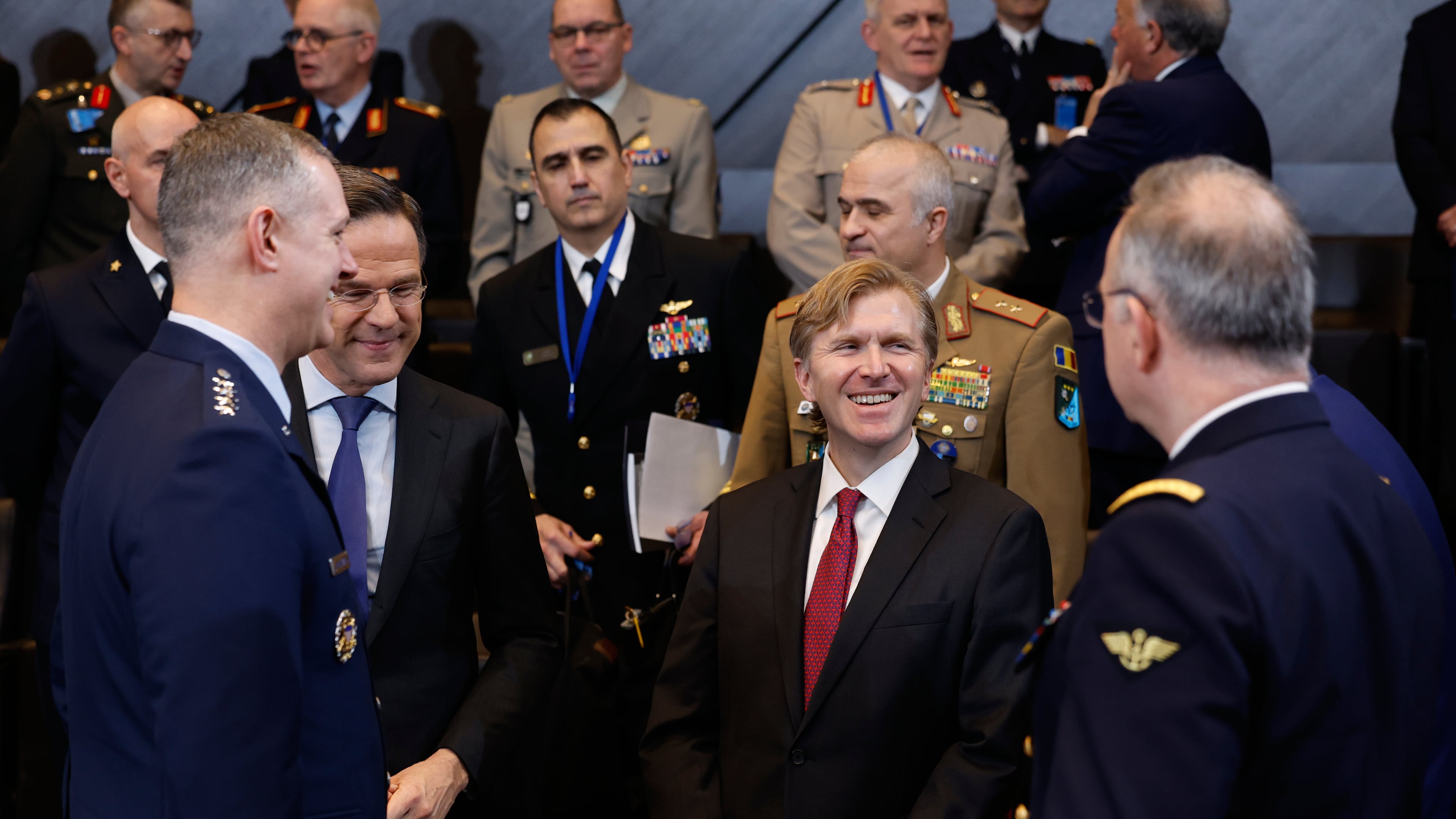 NATO Secretary General Mark Rutte, second left, introduces United States Undersecretary of Defense for Policy Elbridge Colby, center, to military staff during a meeting of the North Atlantic Council in Defense Ministers Session at NATO headquarters in Brussels, Thursday, Feb. 12, 2026. (AP Photo/Geert Vanden Wijngaert)