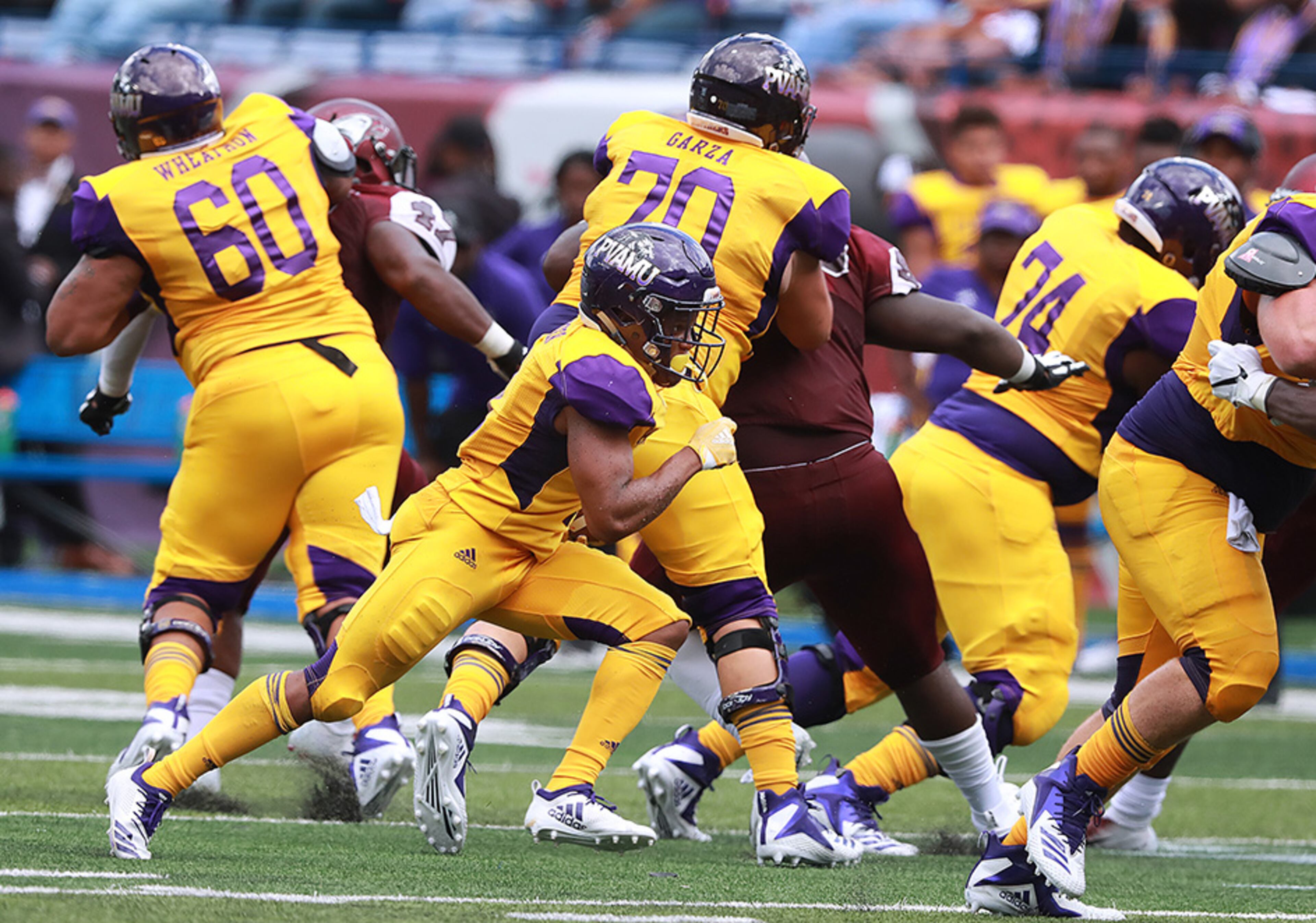 The offensive line gives Prairie View A&M running back Dawonya Tucker plenty of running room as he breaks free for a long run against North Carolina Central during the first half of the MEAC-SWAC Challenge Sunday, Sept. 2, 2018, in Atlanta.
