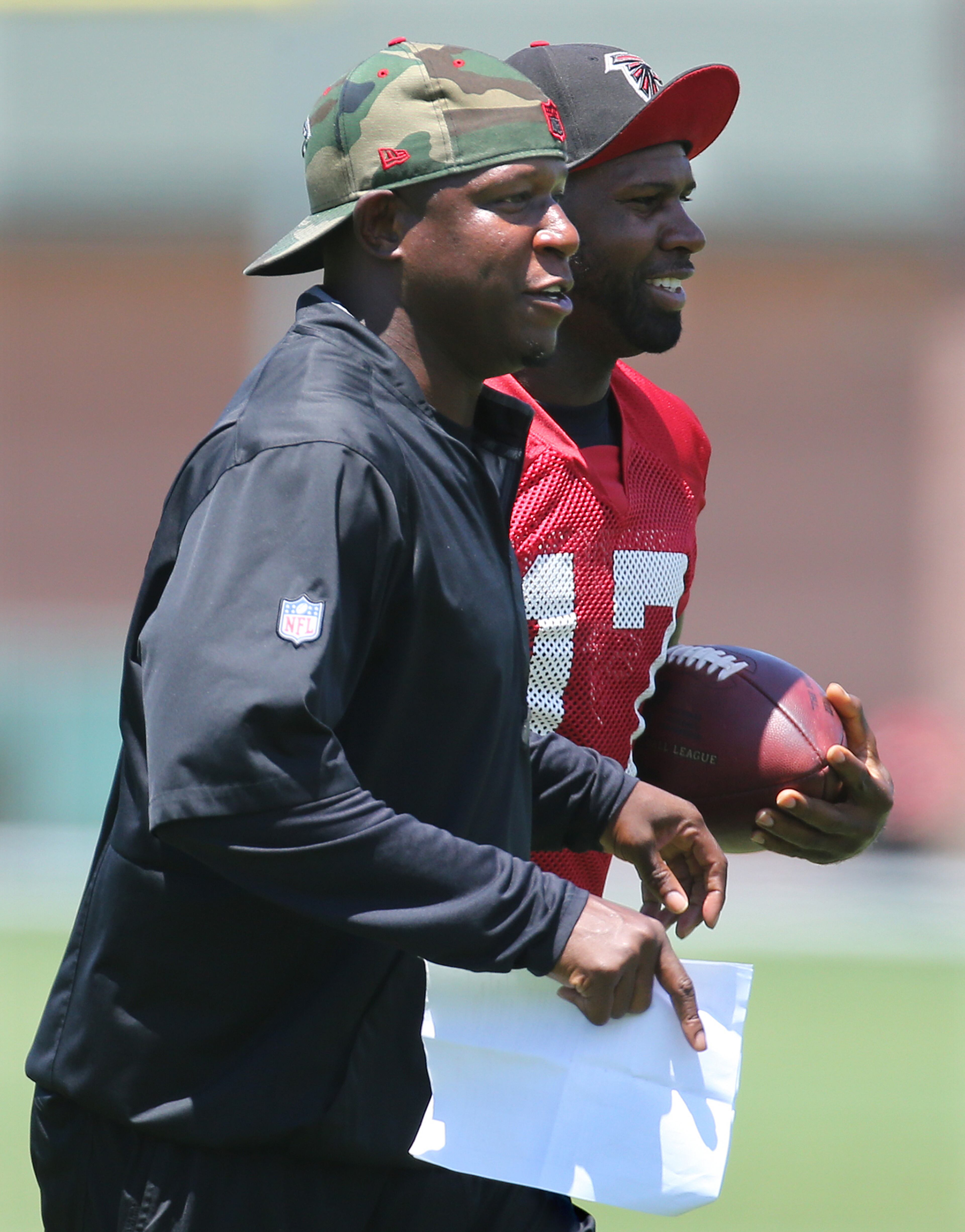 Assistant head coach/wide receivers Raheem Morris with wide receiver Devin Hester during an OTA day on Tuesday, June 7, 2016, in Flowery Branch. Curtis Compton / ccompton@ajc.com