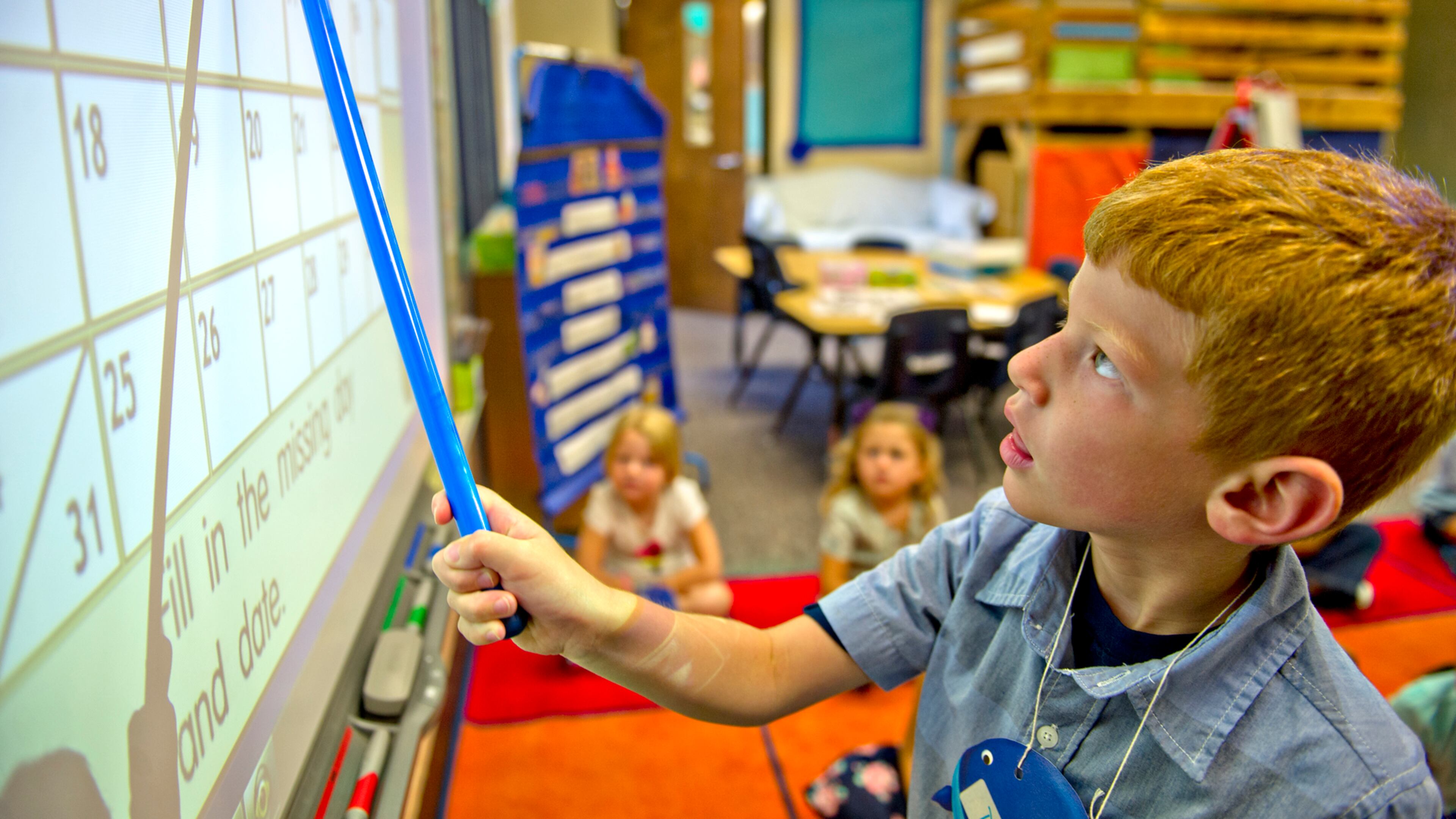 Deacon Pederson uses a smart board during the first day of classes at Davis Elementary School in Marietta on Monday, August 4, 2014. Teachers and administrators at the school dressed as pirates for the first day of school. Students in Cobb County and Atlanta public schools headed back to class on Monday for the new school year. JONATHAN PHILLIPS / SPECIAL