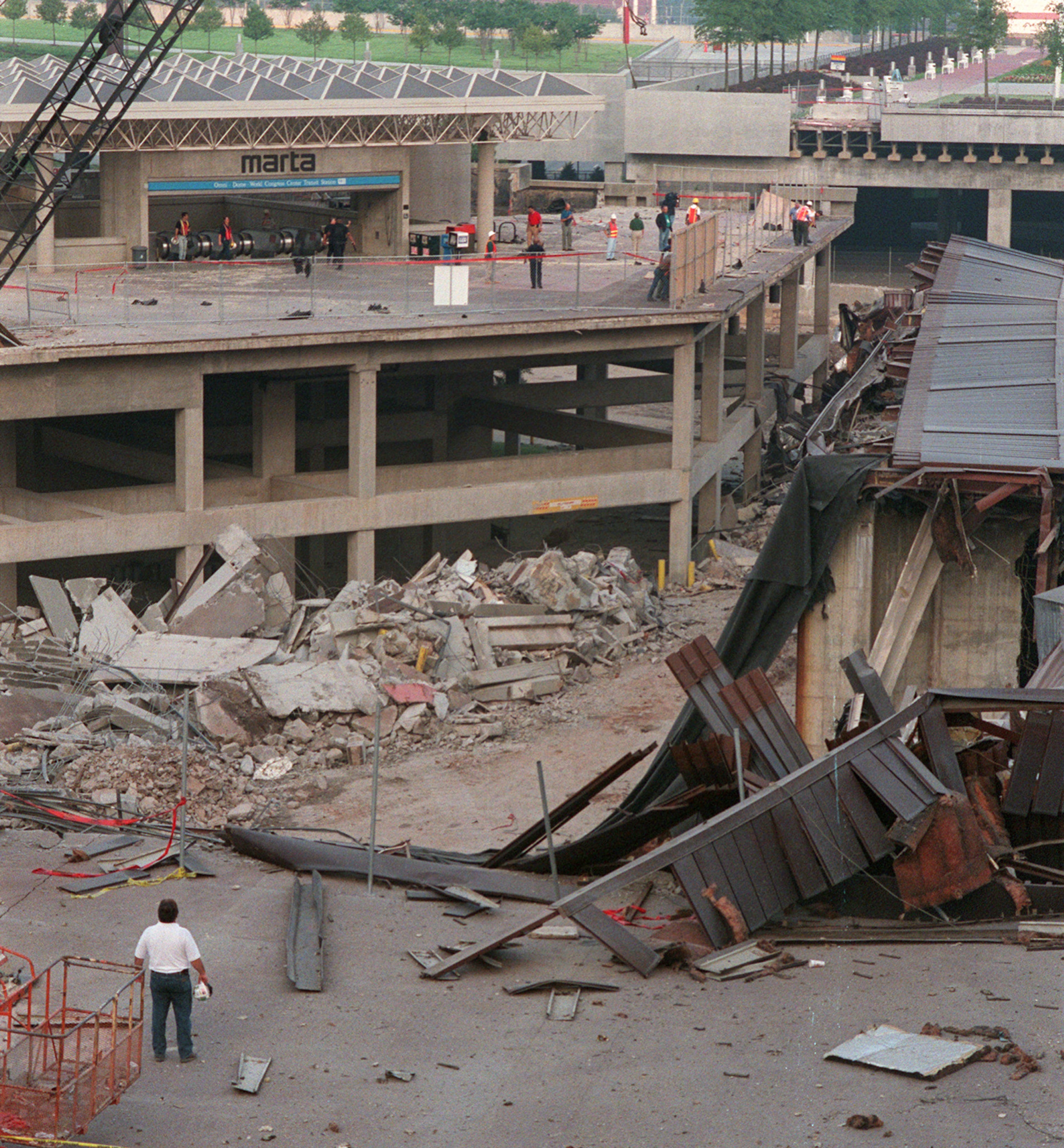 970726 - Atlanta, Georgia - The MARTA Omni station gets a cleanup and inspection shortly after the Omni was imploded right next to it early Saturday morning, July 26, in downtown Atlanta. Marta trains were shut down for (how long??) for safety reasons during the implosion. (AJC Staff Photo/Celine Bufkin)