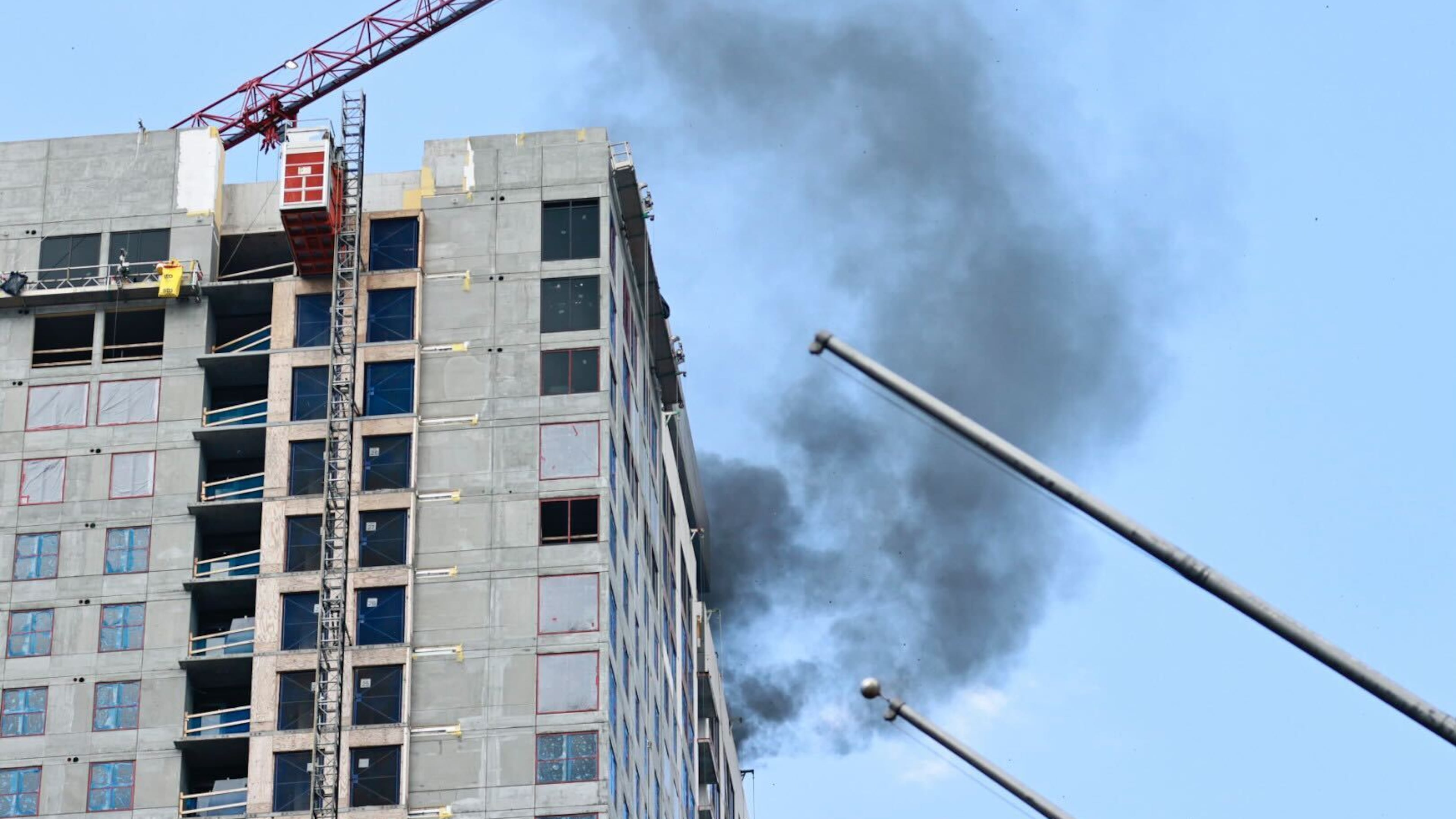 A plume of smoke rises from a fire near the top of a Georgia State University student housing high-rise in downtown Atlanta on Wednesday.