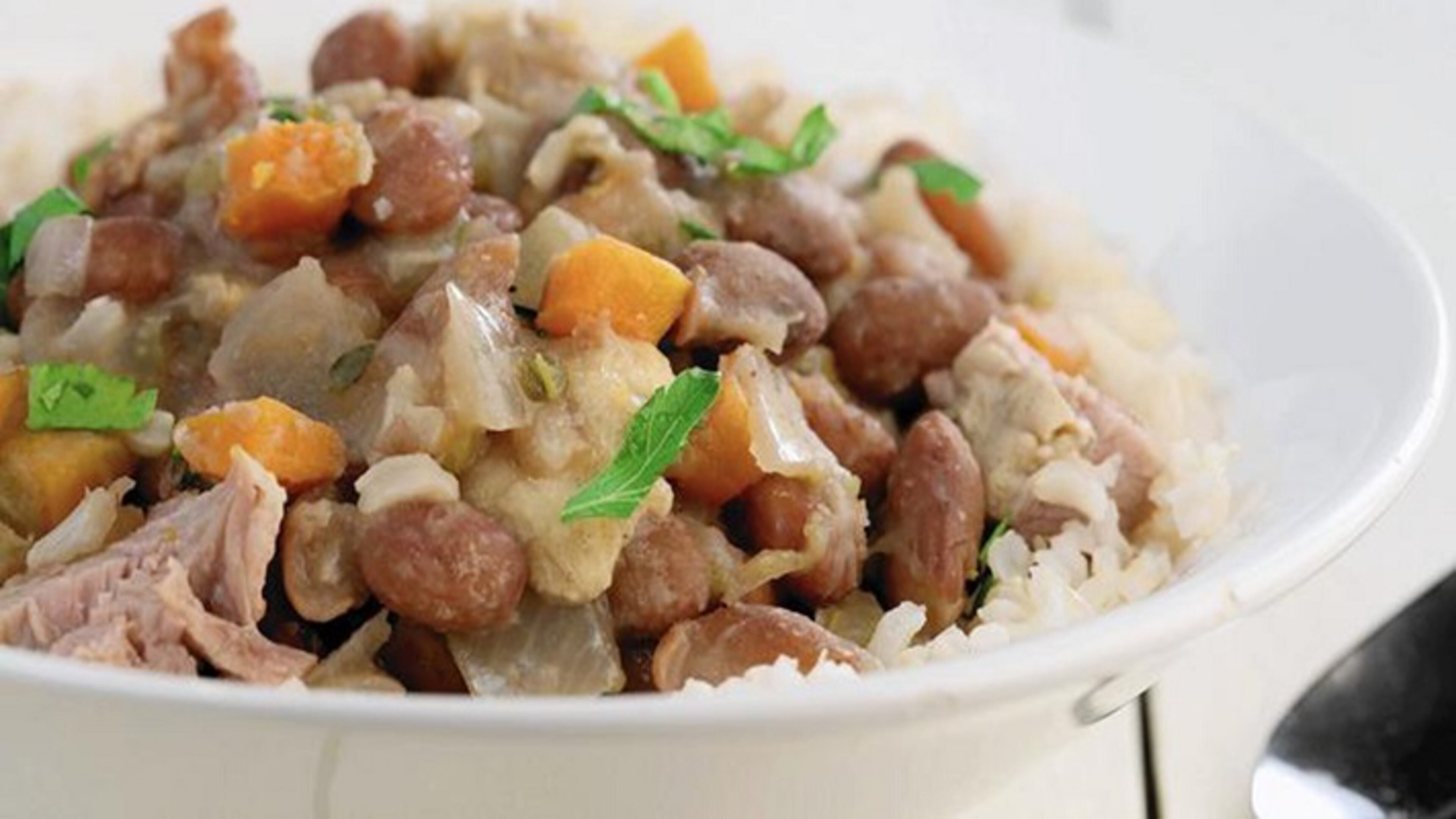Beans are cooked with plenty of aromatic vegetables for a spin on red beans and rice. (Michael Tercha/Chicago Tribune/TNS)