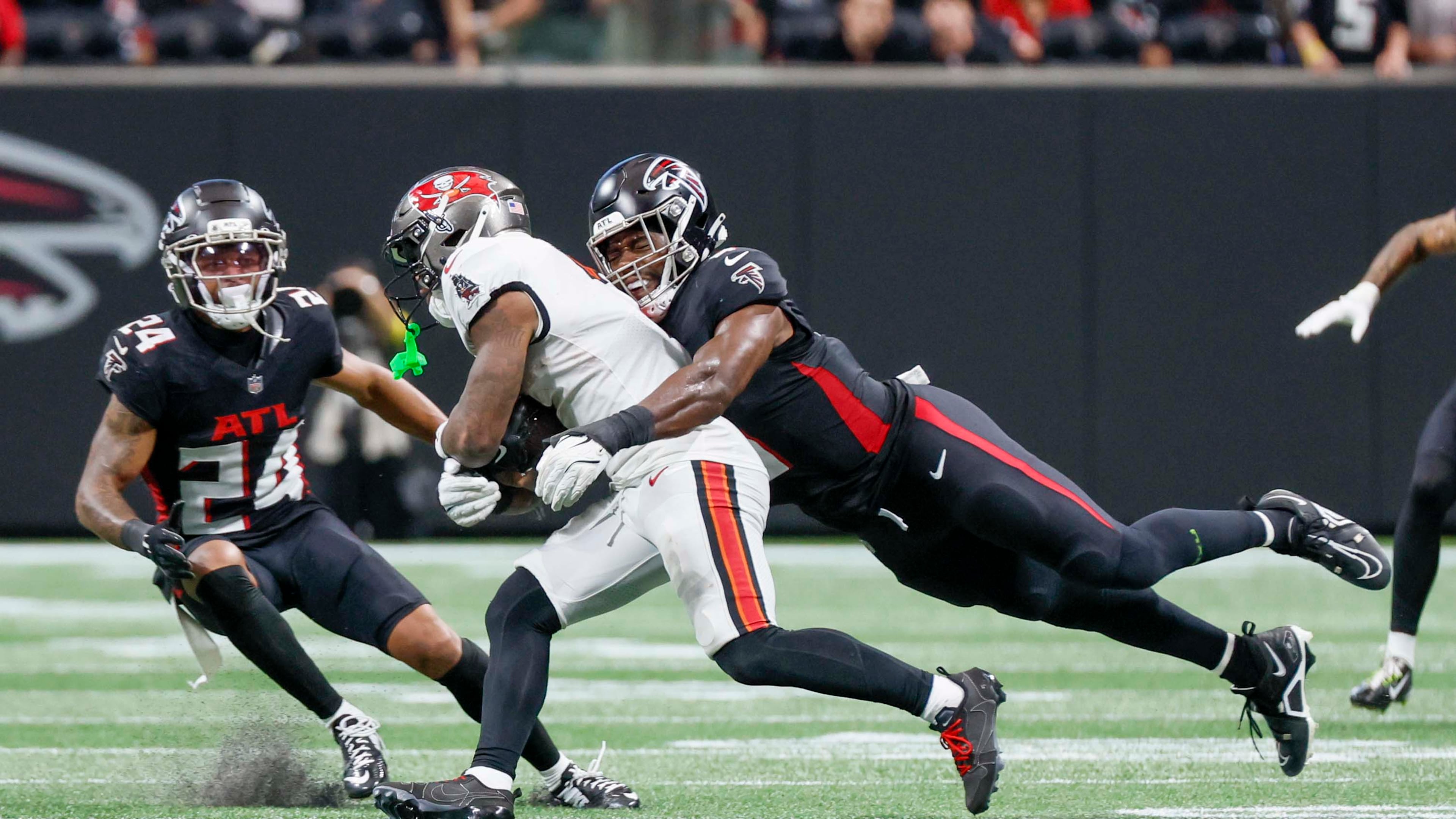 Atlanta Falcons linebacker Divine Deablo has playmaking ability, seen here as he grabs Tampa Bay Buccaneers running back Bucky Irving their Sept. 7 game. (Miguel Martinez/AJC)