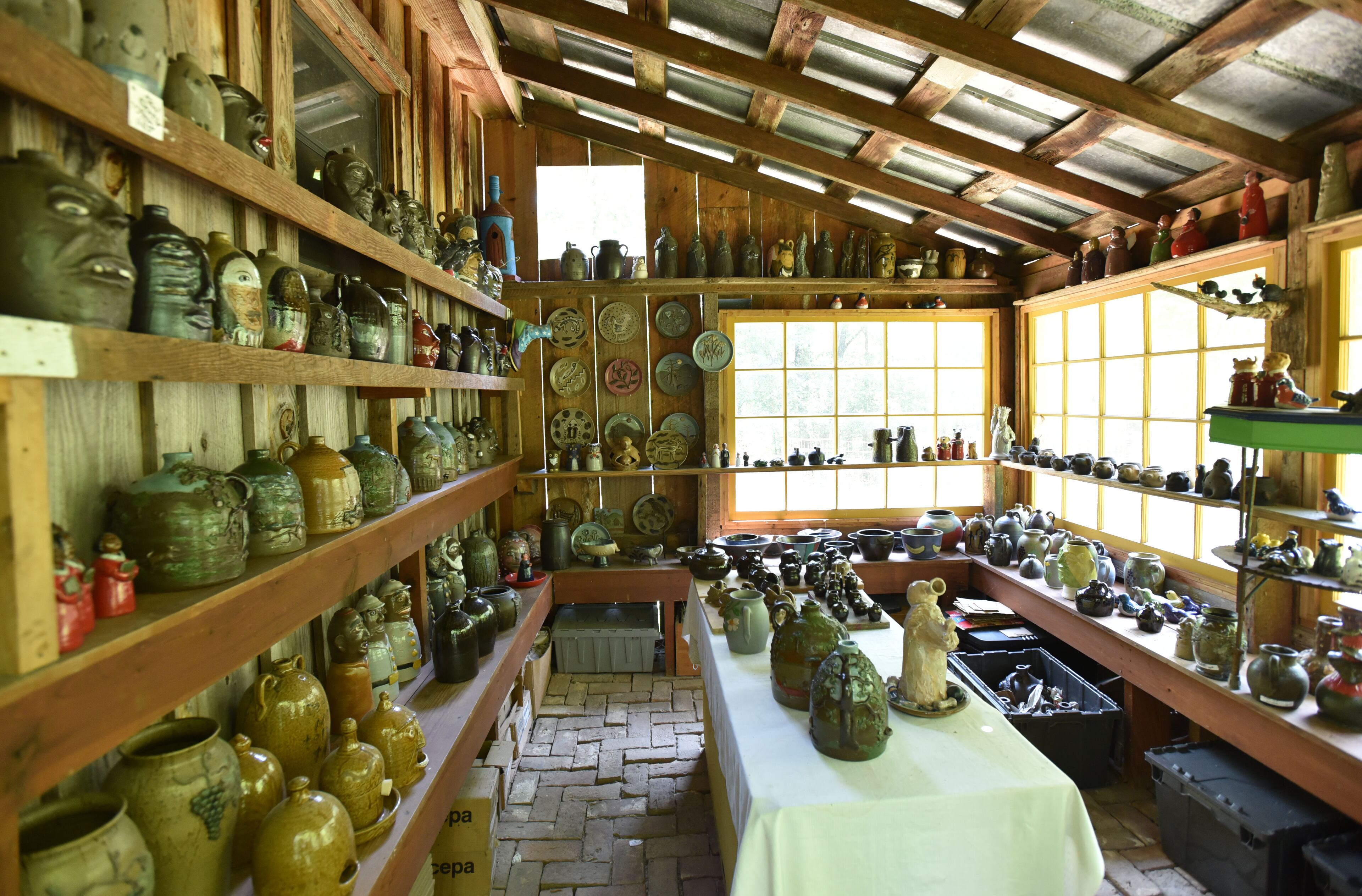 May 9, 2015 Summerville - Pottery by Tom and Judy Touchstone in Armuchee, near Summerville, on Saturday, May 9, 2015. In advance of Finster Fest, May 30-31 in the northwest Georgia town of Summerville. Georgia's most famed folk artist, Finster was known as a great American eccentric, and plenty of eccentric places survive him in this gritty corner of the state. HYOSUB SHIN / HSHIN@AJC.COM