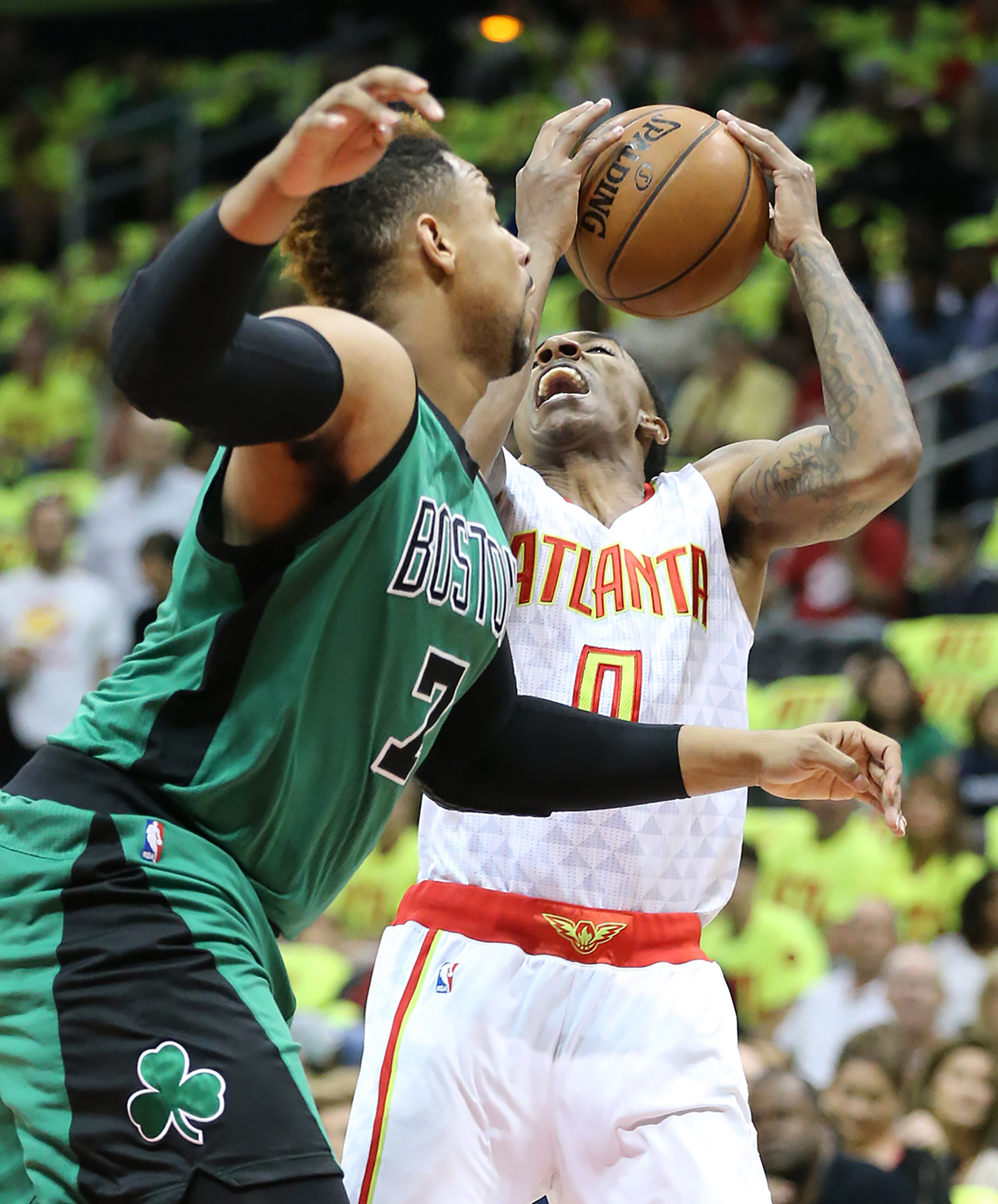 041616 ATLANTA: Hawks guard Jeff Teague is fouled by Celtics forward Jared Sullinger in their NBA Eastern Conference first round playoff game at Philips Arena on Saturday, April 16, 2016. Curtis Compton / ccompton@ajc.com