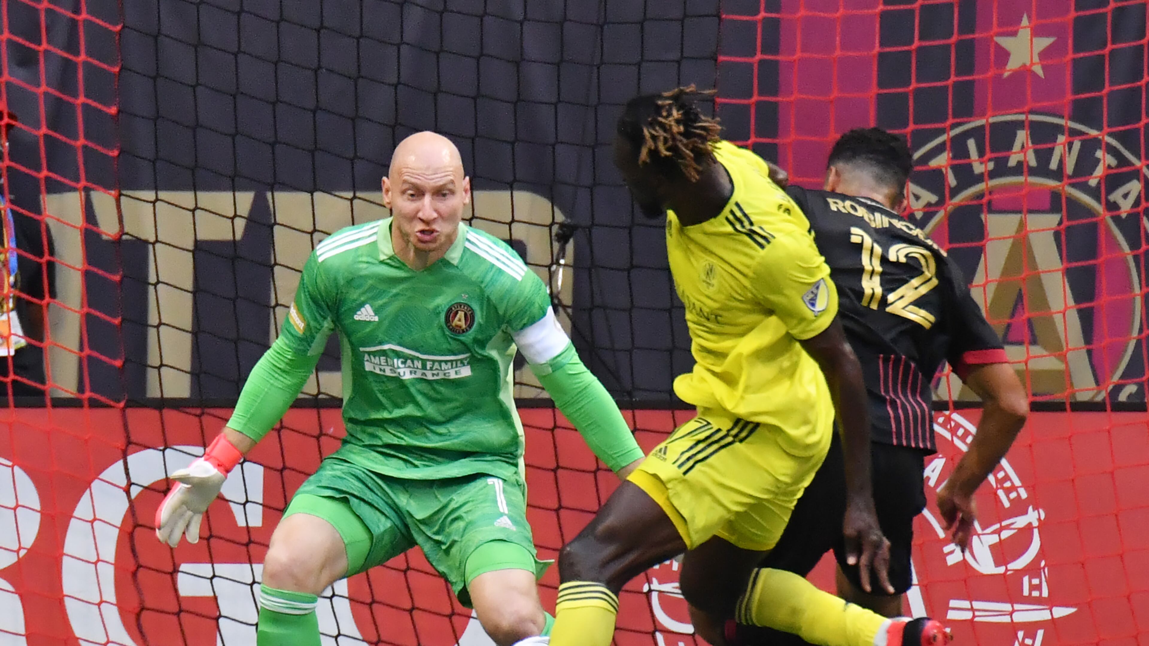 August 28, 2021 Atlanta - Atlanta United's goalkeeper Brad Guzan (1) blocks the shot by Nashville SC's forward Rodrigo Pineiro (11) as Atlanta United's defender Miles Robinson (12) defenses during the first half in a MLS soccer match at at Mercedes-Benz Stadium in Atlanta on Saturday, August 28, 2021. (Hyosub Shin / Hyosub.Shin@ajc.com)