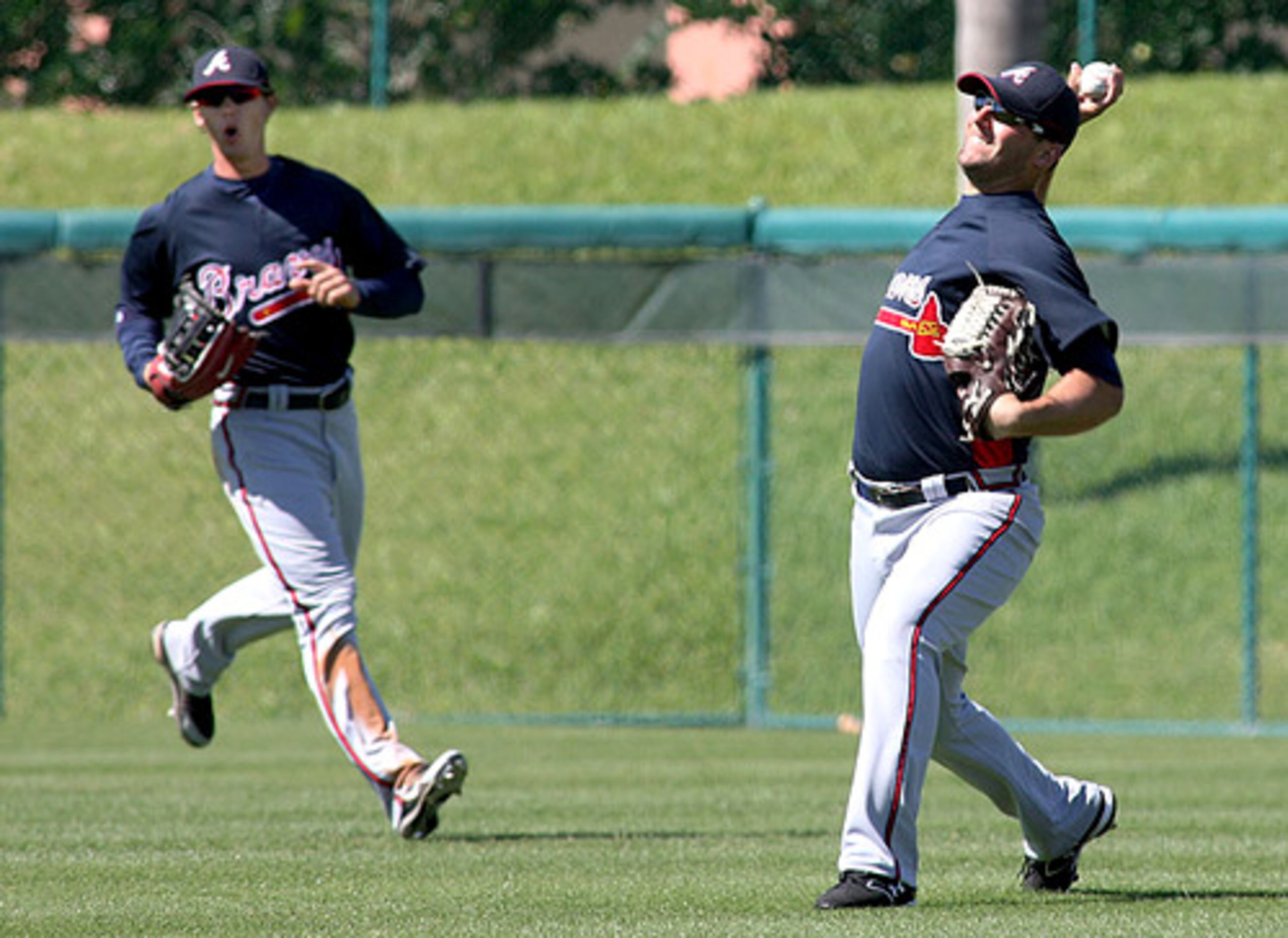 Braves' centerfield prospect Jordan Schafer (left) runs in to cover behind Jeff Francoeur as he makes a play toward the infield on a hit ball in the seventh.