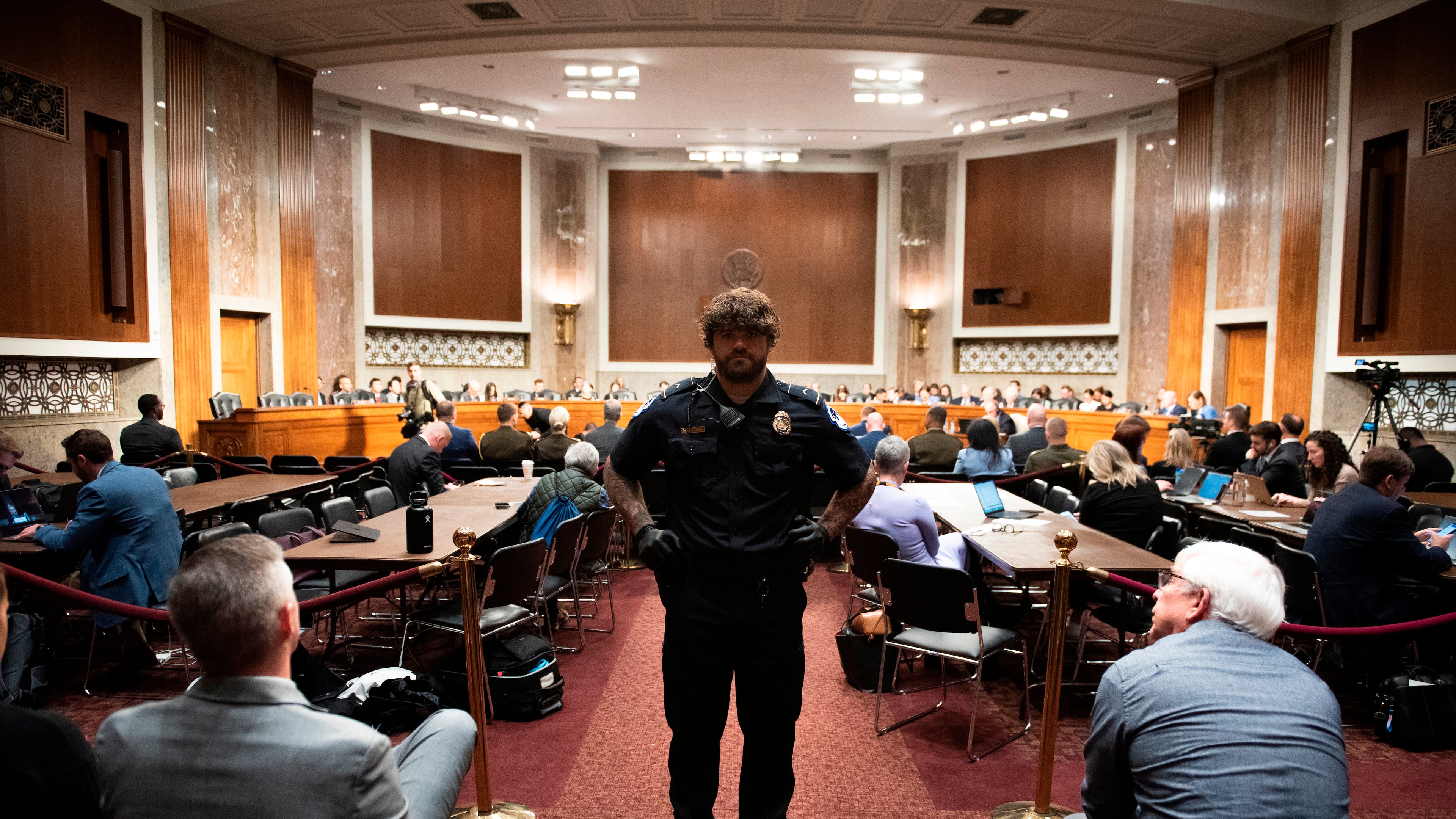 A U.S. Capitol Police officer stands guard as the Senate Armed Services Committee holds a hearing on the Department of Defense budget, on Capitol Hill, in Washington, Thursday, April 30, 2026. (AP Photo/Cliff Owen)