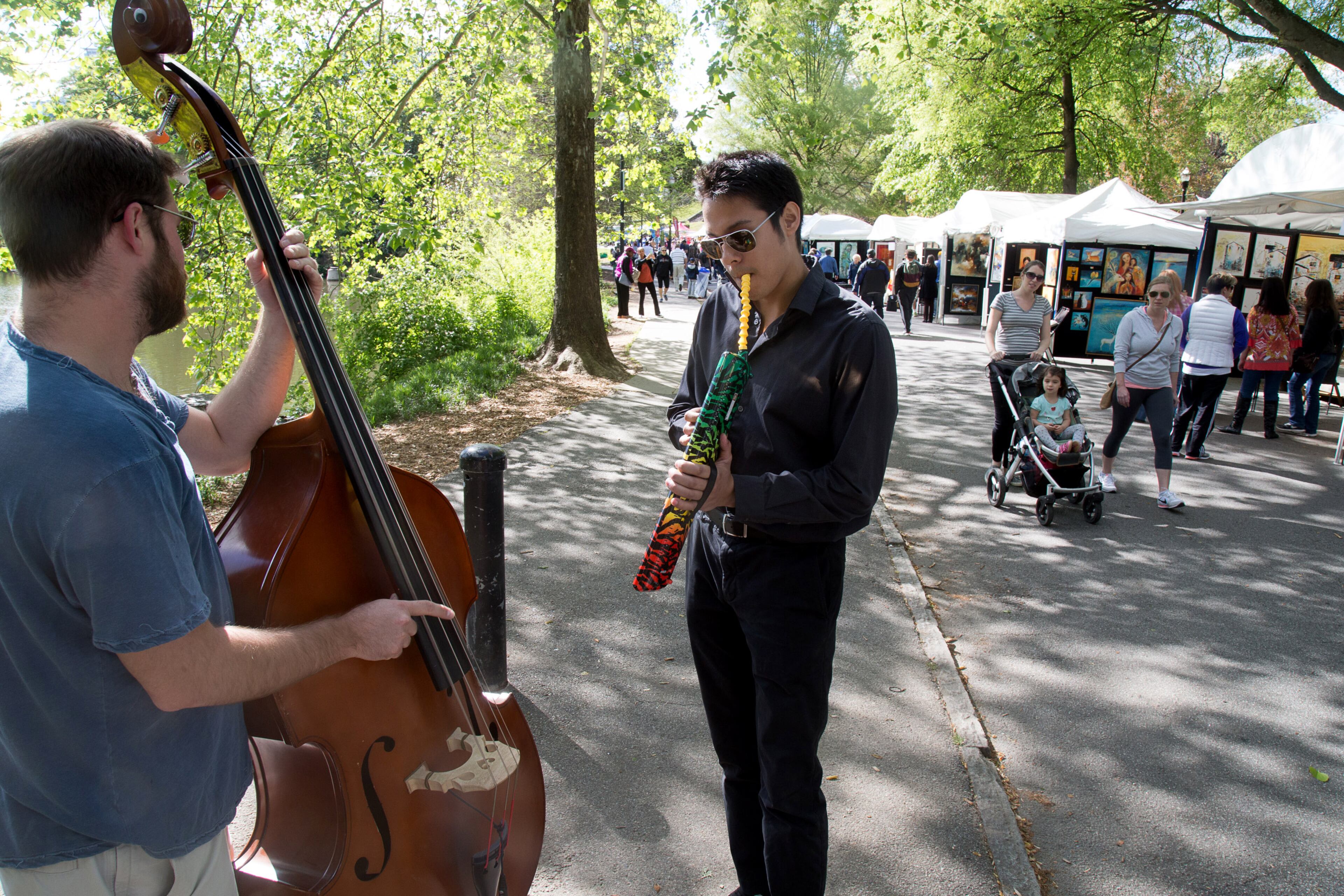 Andrew Barnes and Forrest Obnamia start an impromptu jam session during the 80th Annual Atlanta Dogwood Festival in Piedmont Park in Midtown Friday April 8, 2016. STEVE SCHAEFER / SPECIAL TO THE AJC