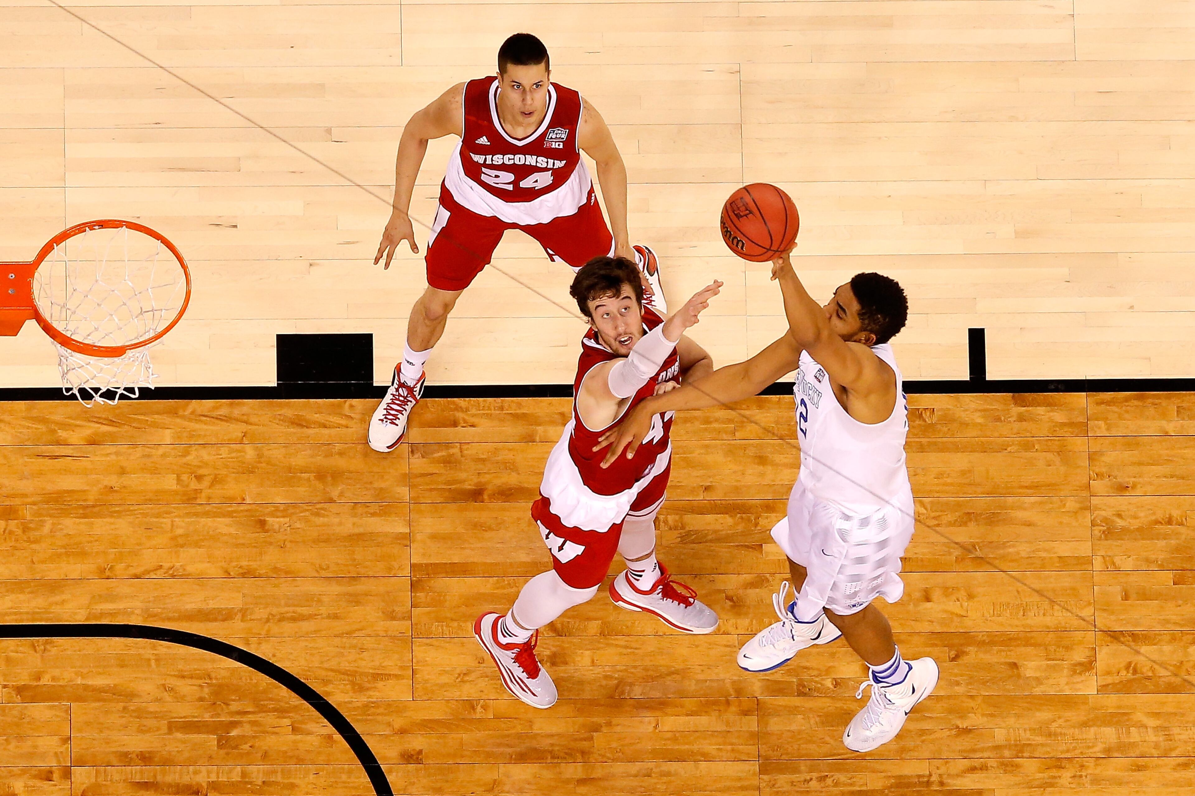 INDIANAPOLIS, IN - APRIL 04: Karl-Anthony Towns #12 of the Kentucky Wildcats shoots against Frank Kaminsky #44 of the Wisconsin Badgers in the second half during the NCAA Men's Final Four Semifinal at Lucas Oil Stadium on April 4, 2015 in Indianapolis, Indiana. (Photo by Andy Lyons/Getty Images)