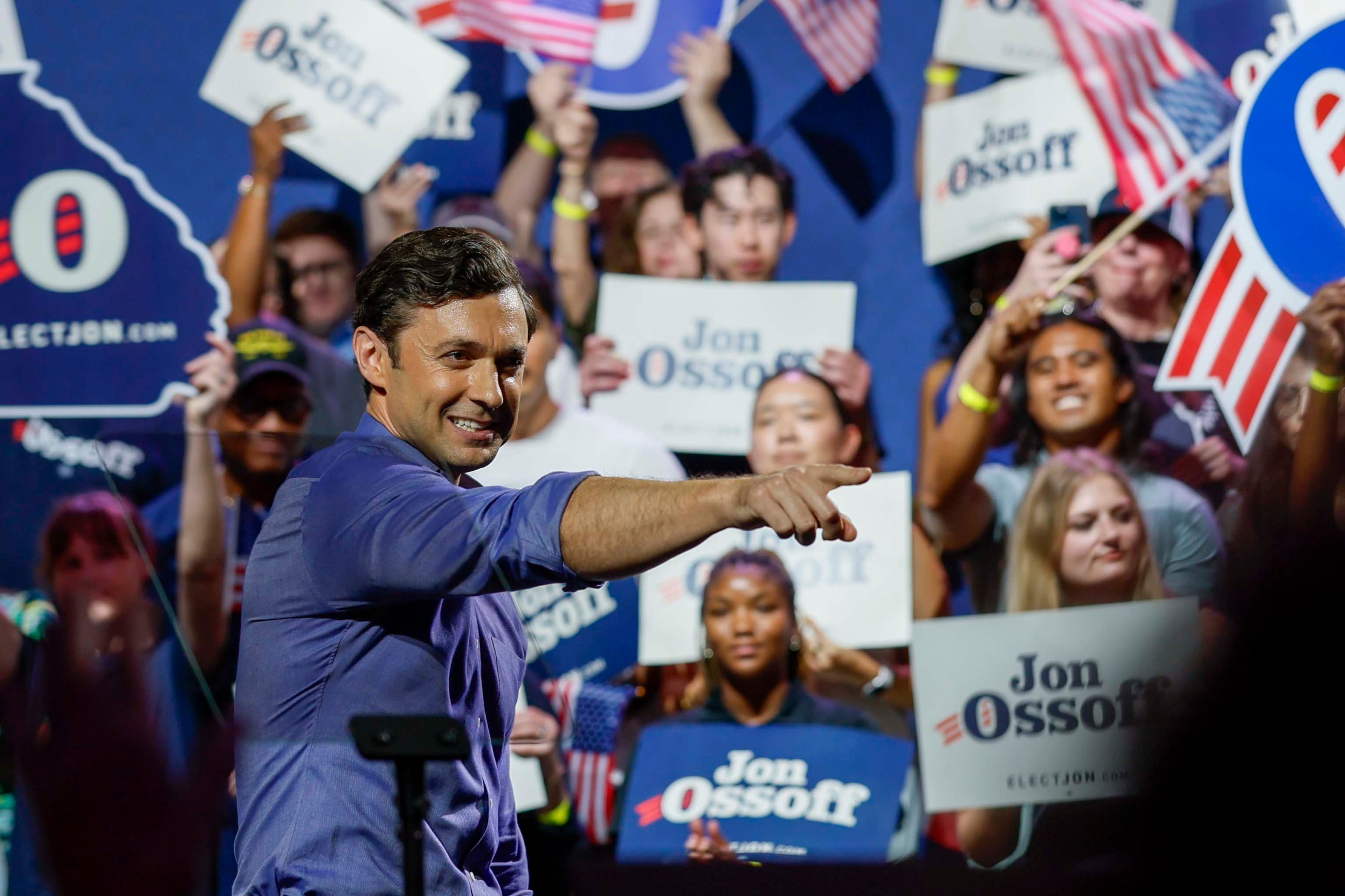 U.S. Sen. Jon Ossoff points to the crowd after delivering a speech at a campaign rally in Atlanta earlier this month. (Miguel Martinez/AJC)