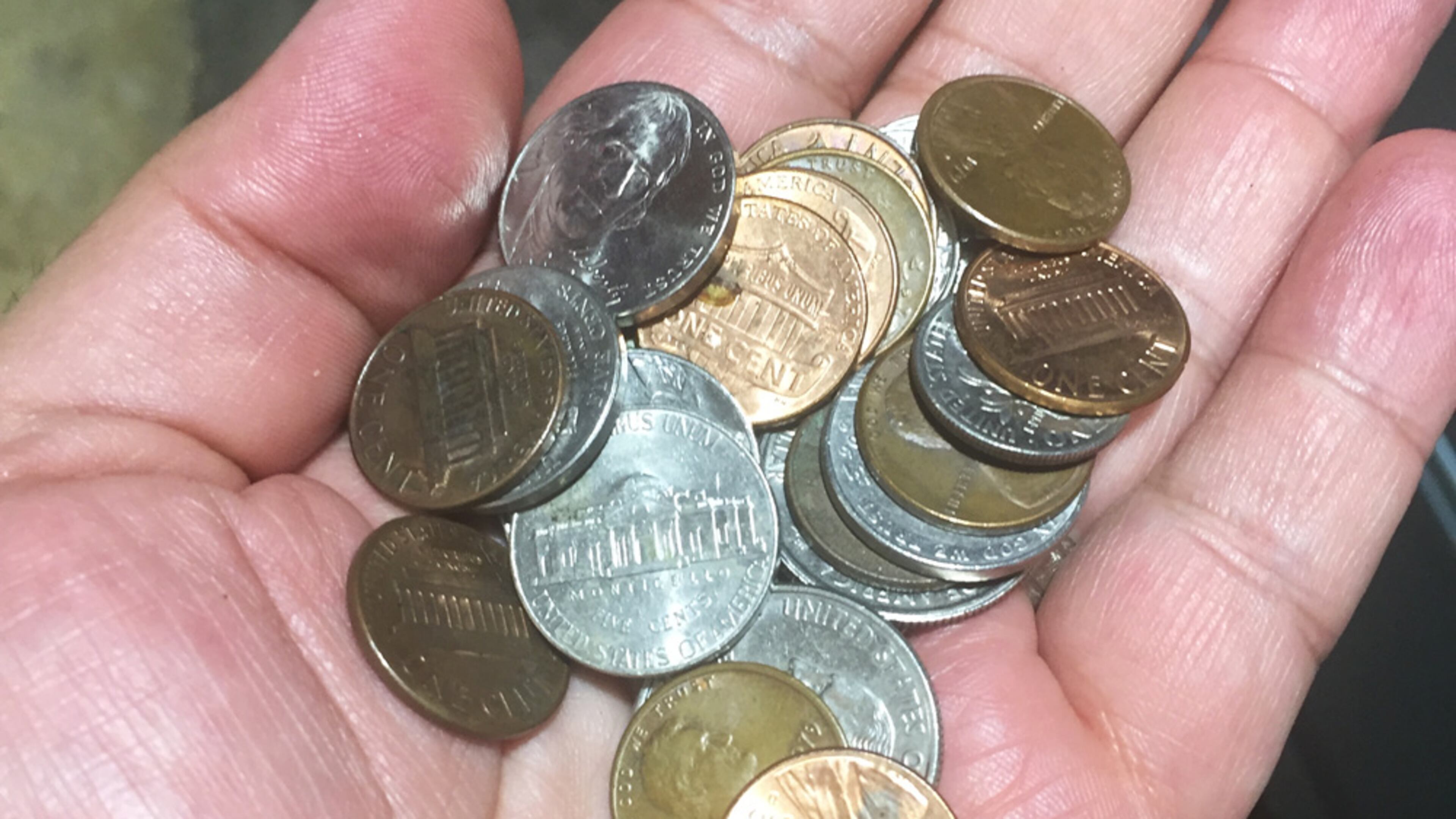 When there's no Apple Pay option or a wallet, coins scrounged from the inside of a car are one way to pay for gas.