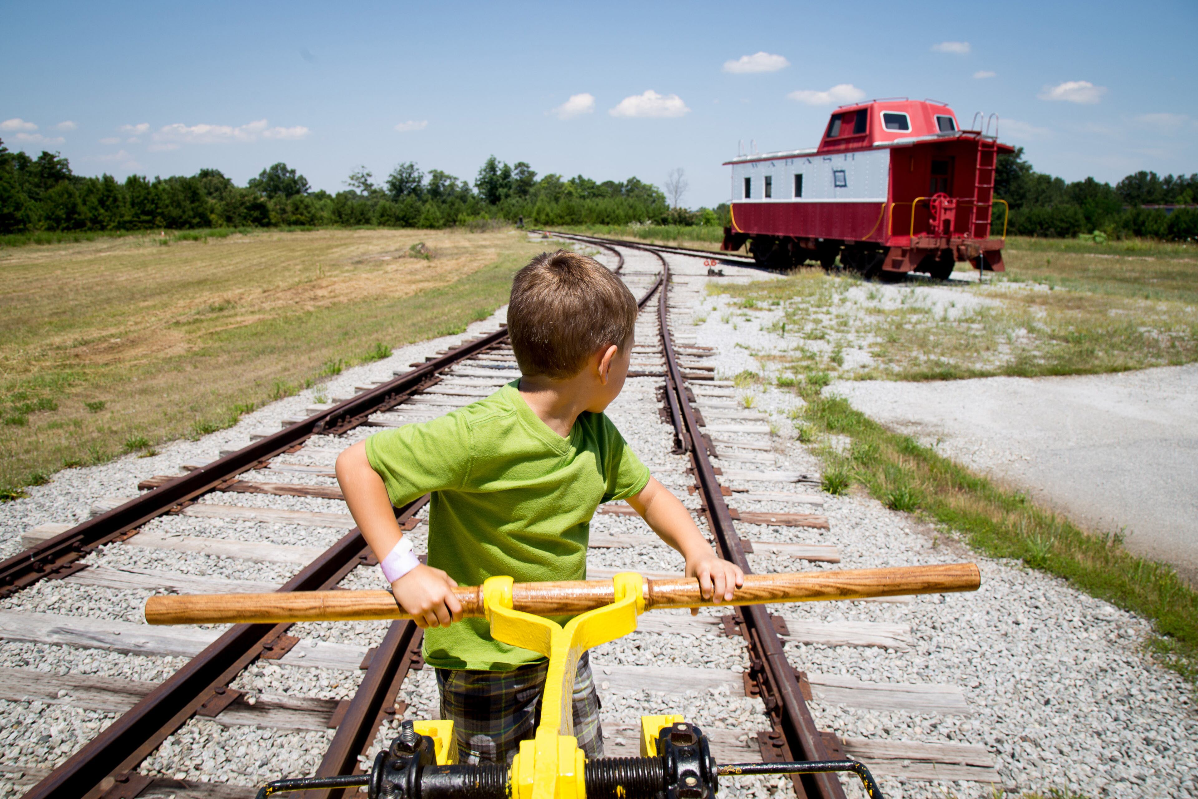 Grant Gerhardt rides on a restored hand car during the dedication celebration of the museum's new General Electric 5 ton locomotive at the Southeastern Railway Museum in Duluth, GA Saturday, June 11, 2016. STEVE SCHAEFER / SPECIAL TO THE AJC