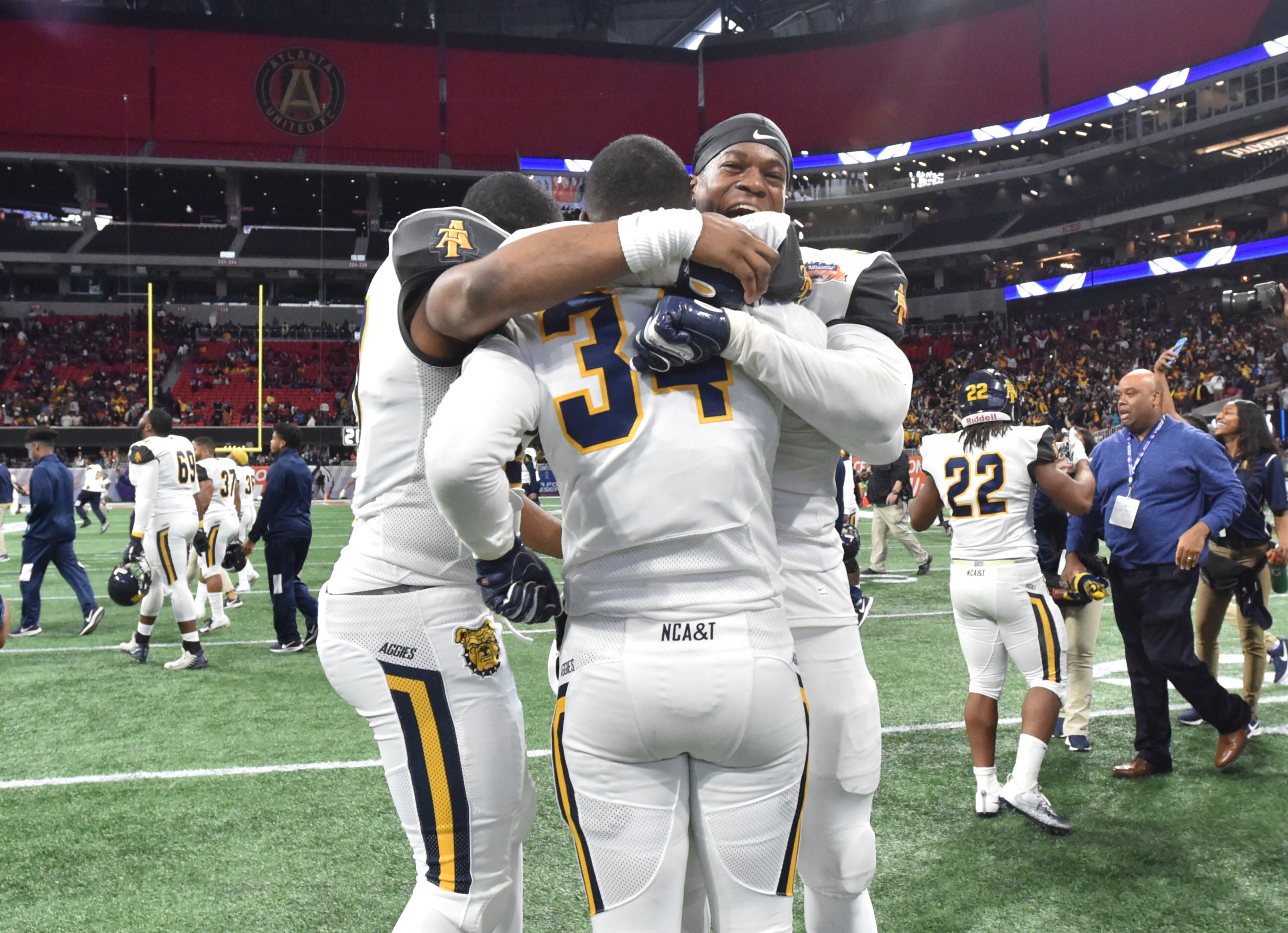 December 15, 2018 Atlanta - North Carolina A&T players celebrate their victory over the Alcorn State during the 2018 Celebration Bowl at Mercedes-Benz Stadium on Saturday, December 15, 2018. North Carolina A&T won 24-22 over the Alcorn State. HYOSUB SHIN / HSHIN@AJC.COM