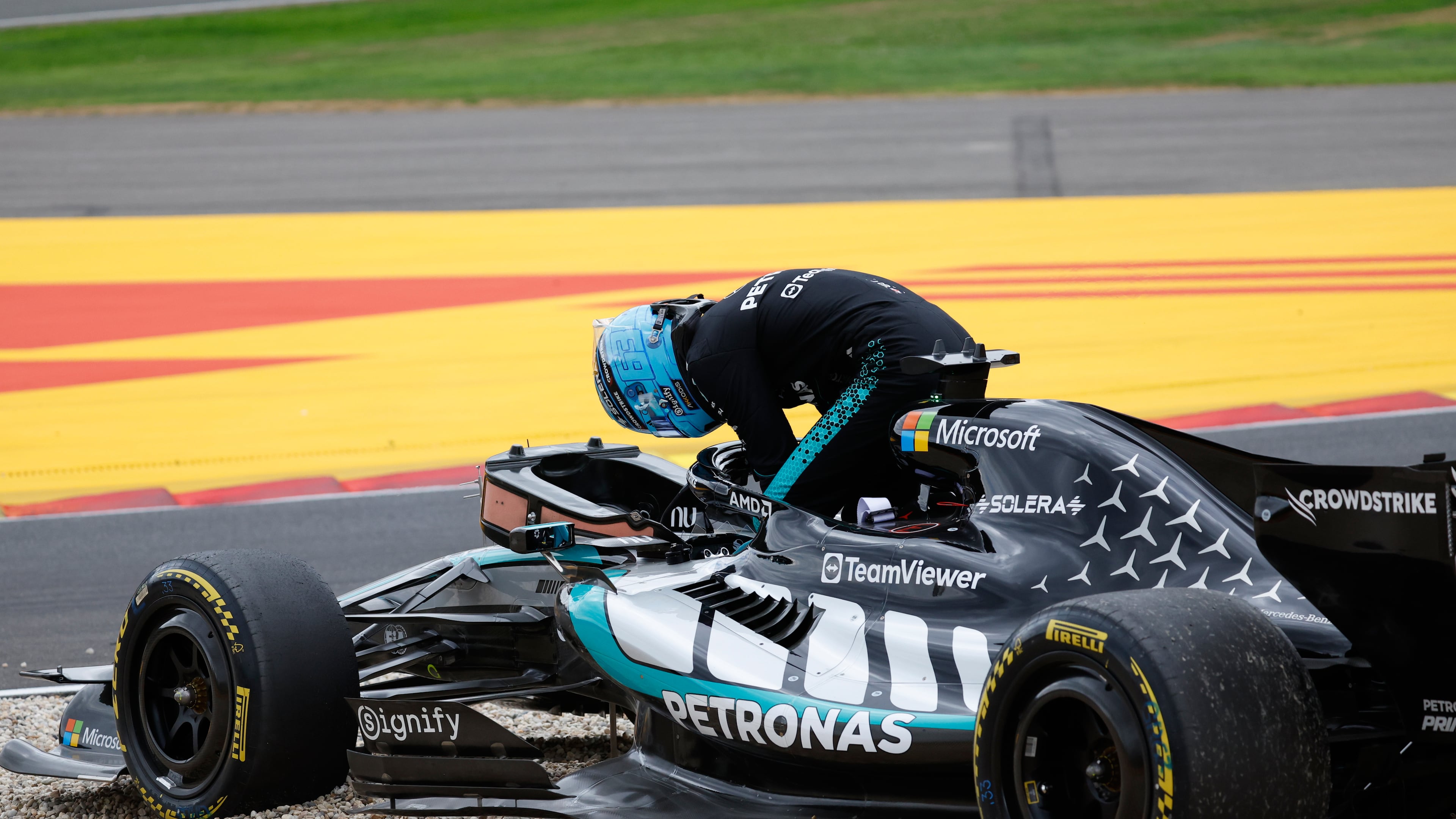 Mercedes driver George Russell of Britain gets out of his car after going off the track during the Formula One Grand Prix at the Spa-Francorchamps racetrack in Spa, Belgium, Sunday, July 19, 2026. (AP Photo/Geert Vanden Wijngaert)