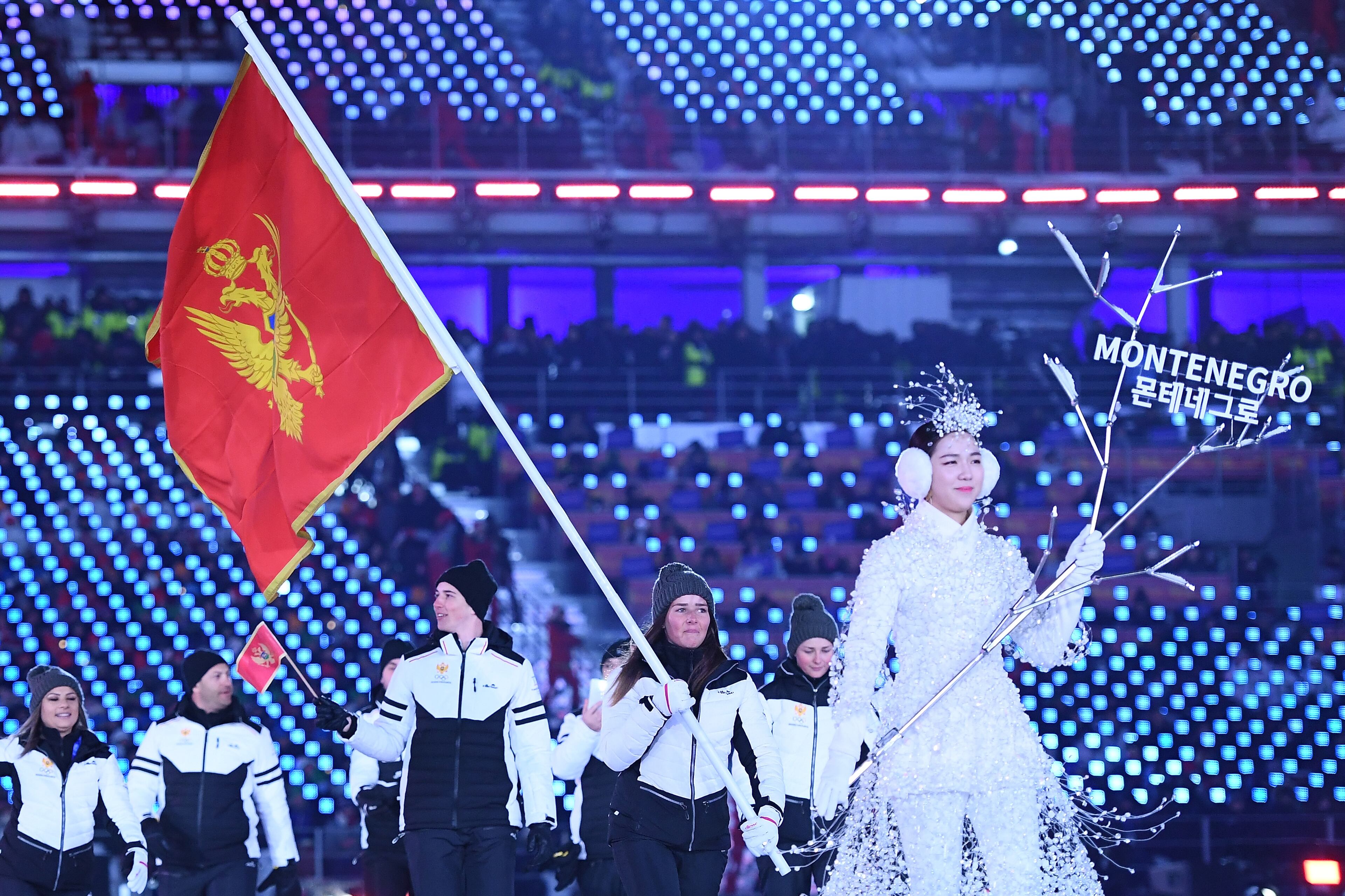 PYEONGCHANG-GUN, SOUTH KOREA - FEBRUARY 09: Flag bearer Jelena Vujicic of Montenegro leads the team during the Opening Ceremony of the PyeongChang 2018 Winter Olympic Games at PyeongChang Olympic Stadium on February 9, 2018 in Pyeongchang-gun, South Korea. (Photo by Quinn Rooney/Getty Images)