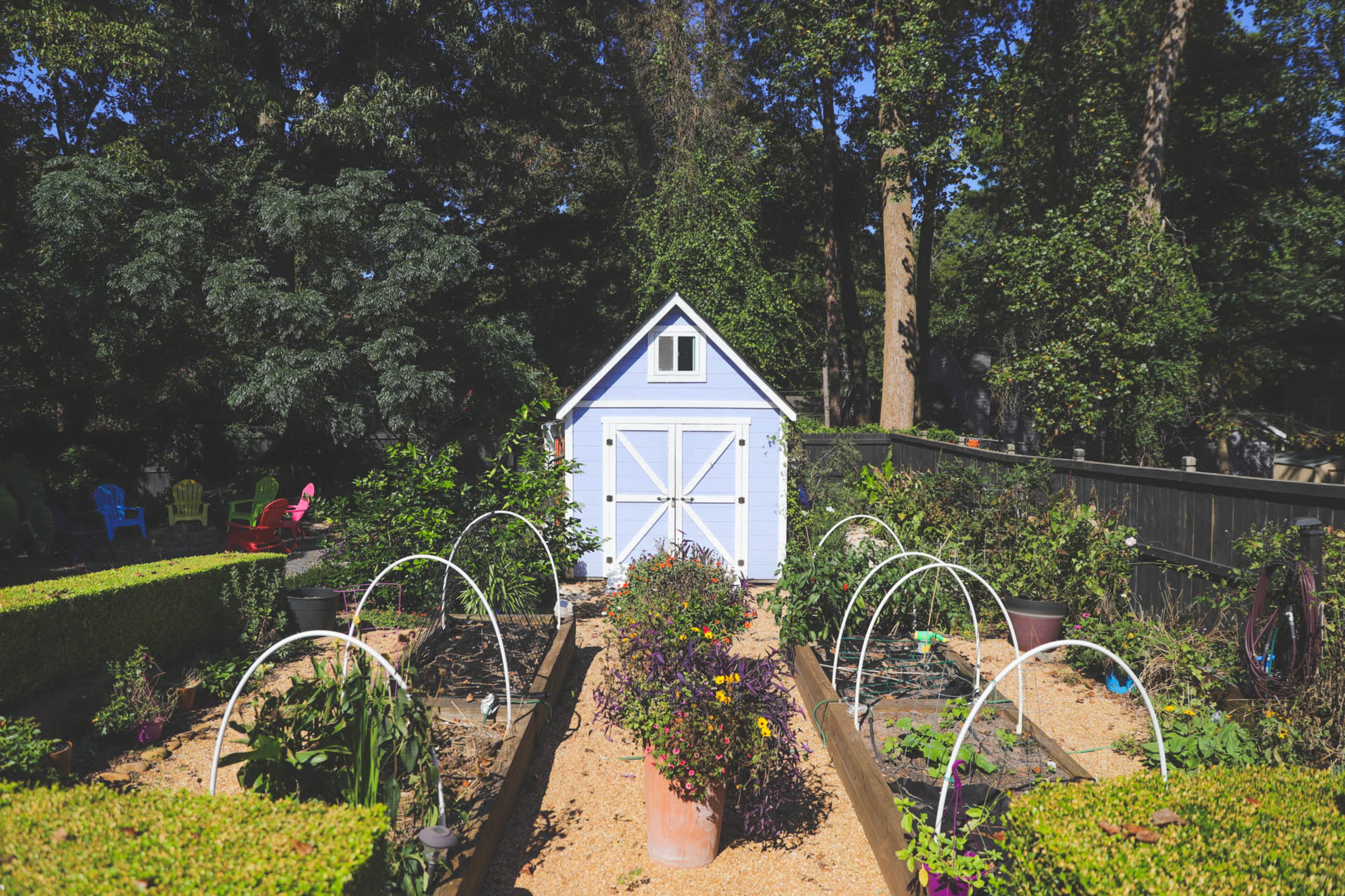 Beyond the patio and pergola in their backyard, Liza and Kenneth Hare have an abundant garden where they grow vegetables and flowers. When Liza Hare originally imagined the space she saw each zone of the backyard as it is now, full of comfortable seating and whimsical color. Text by Shannon Dominy/Photo by Reynolds Rogers