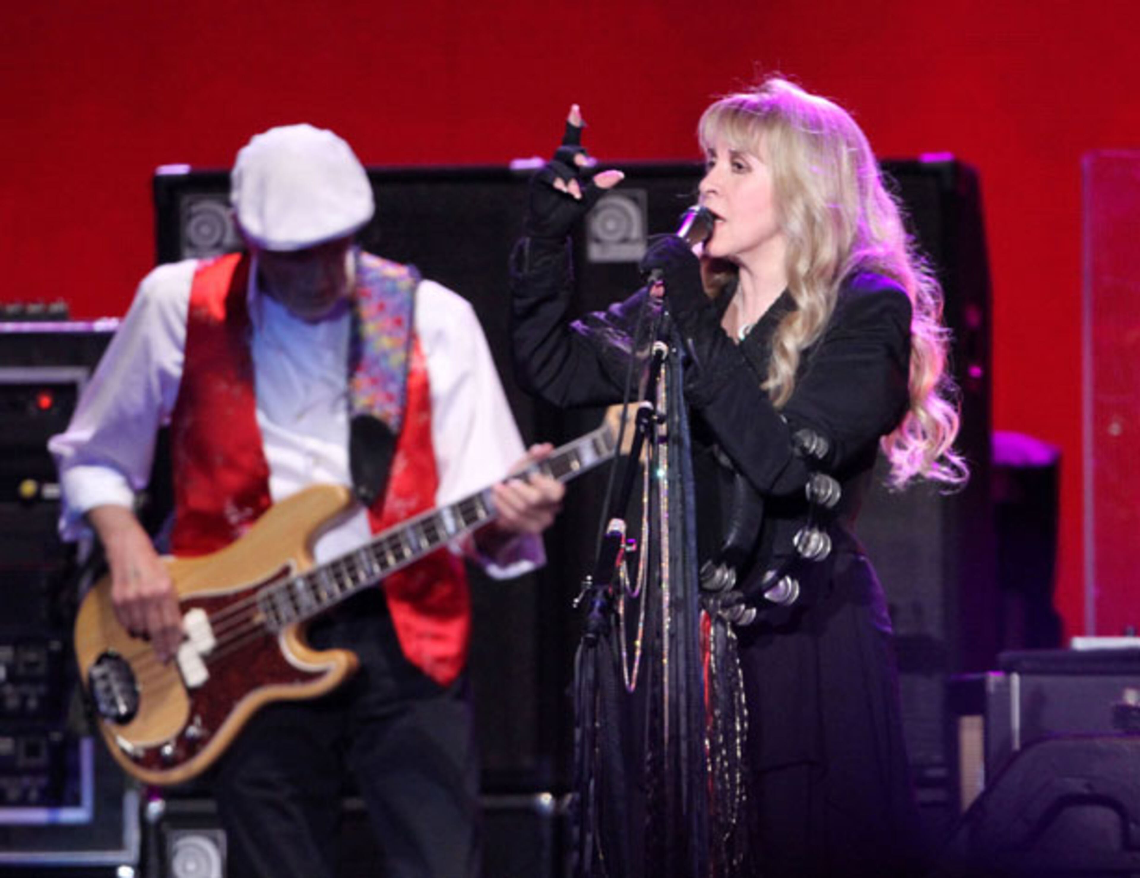 John McVie and Stevie Nicks perform during Fleetwood Mac's On With the Show tour stop at a sold-out Philips Arena in Atlanta Wednesday, Dec. 17, 2014. The tour marks the first time in 16 years that Stevie Nicks, Mick Fleetwood, Lindsey Buckingham and John McVie have toured with Christine McVie. Robb D. Cohen/RobbsPhotos.com