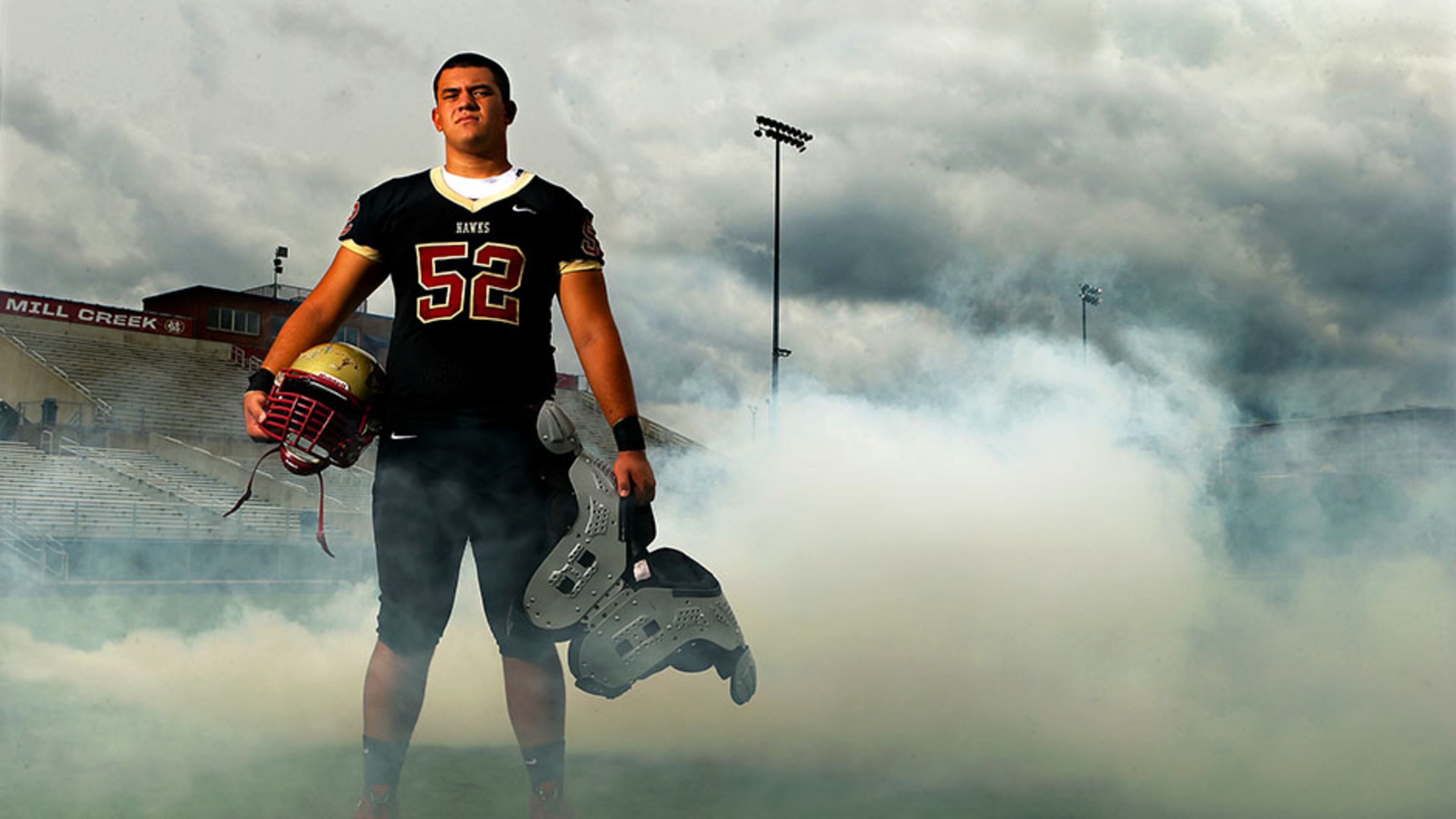 072114 HOSCHTON: Offensive lineman Kaleb Kim poses for a portrait on the football field at Mill Creek High School on Monday, July 21, 2014, in Bogart. CURTIS COMPTON / CCOMPTON@AJC.COM Mill Creek offensive lineman Kaleb Kim