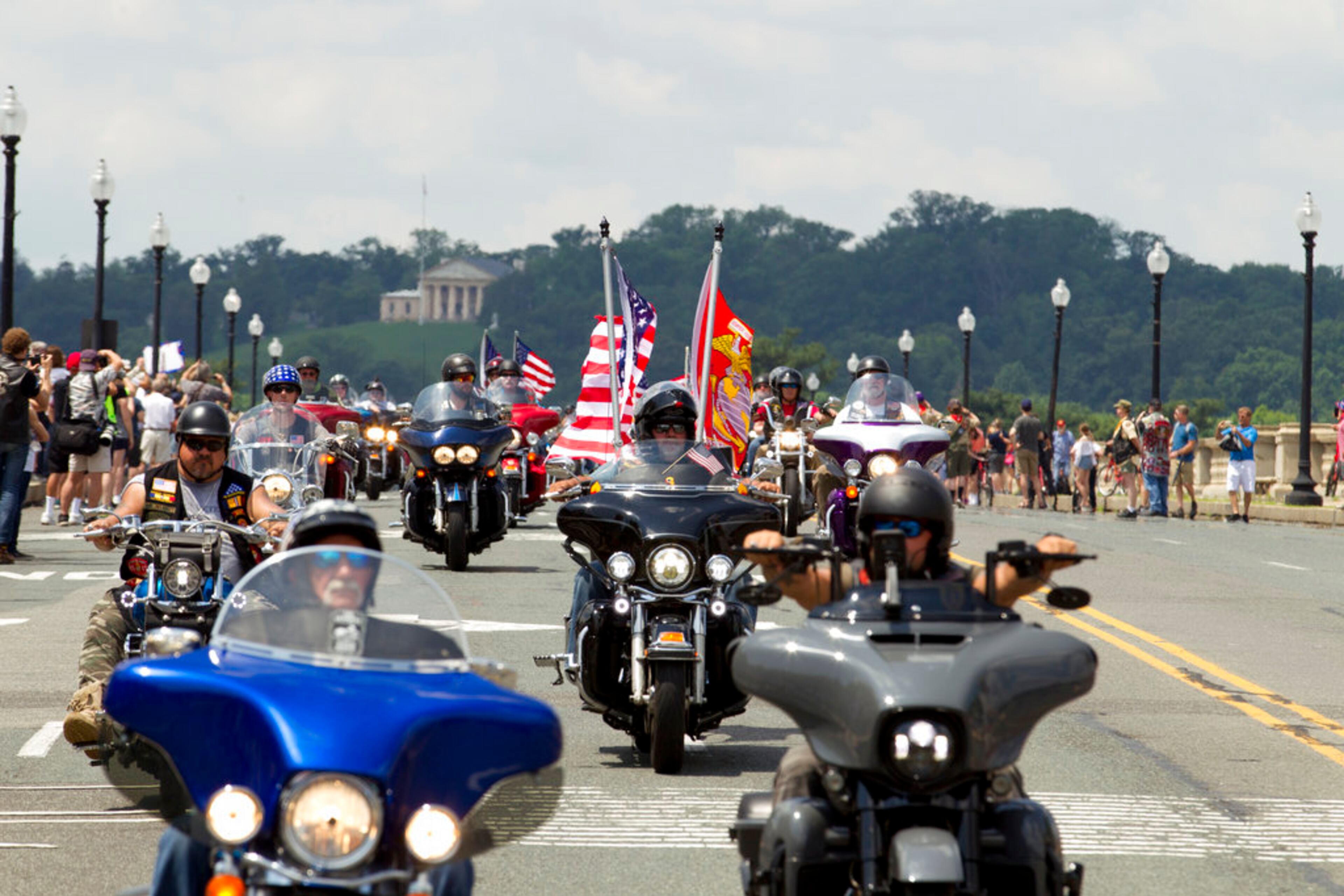 Participants in the Rolling Thunder motorcycle rally ride past Arlington Memorial Bridge, during the annual Rolling Thunder parade, ahead of Memorial Day on Sunday, May 27, 2018, in Washington. (AP Photo/Jose Luis Magana)