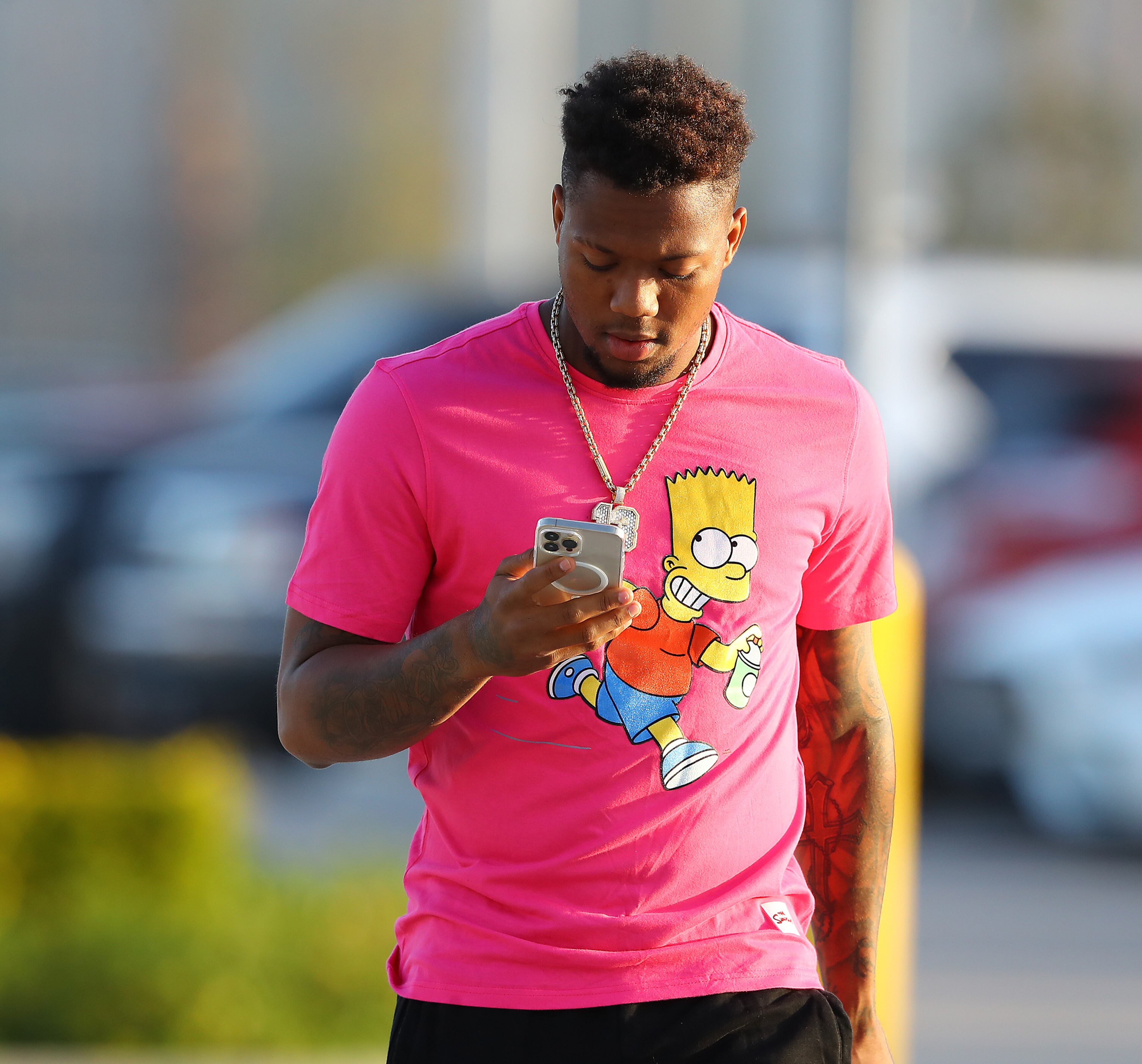 Braves outfielder Ronald Acuna sports a Bart Simpson shirt as he arrives for another day of Spring Training on Thursday, March 17, 2022, in North Port. “Curtis Compton / Curtis.Compton@ajc.com”