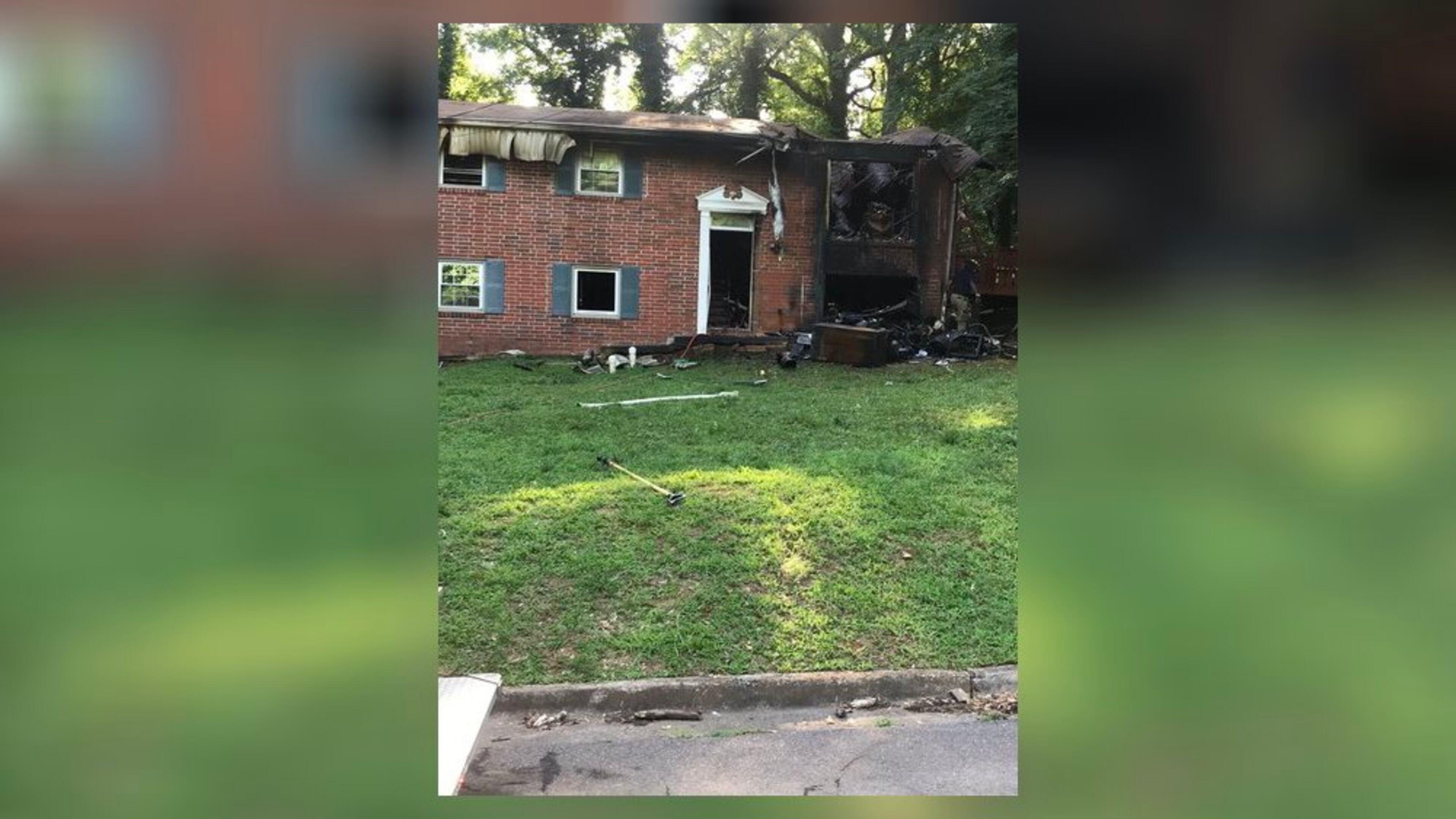 An East Point firefighter was hospitalized after suffering heat exhaustion while battling a blaze at a two-story home, authorities said. Two dogs were killed in the fire.
