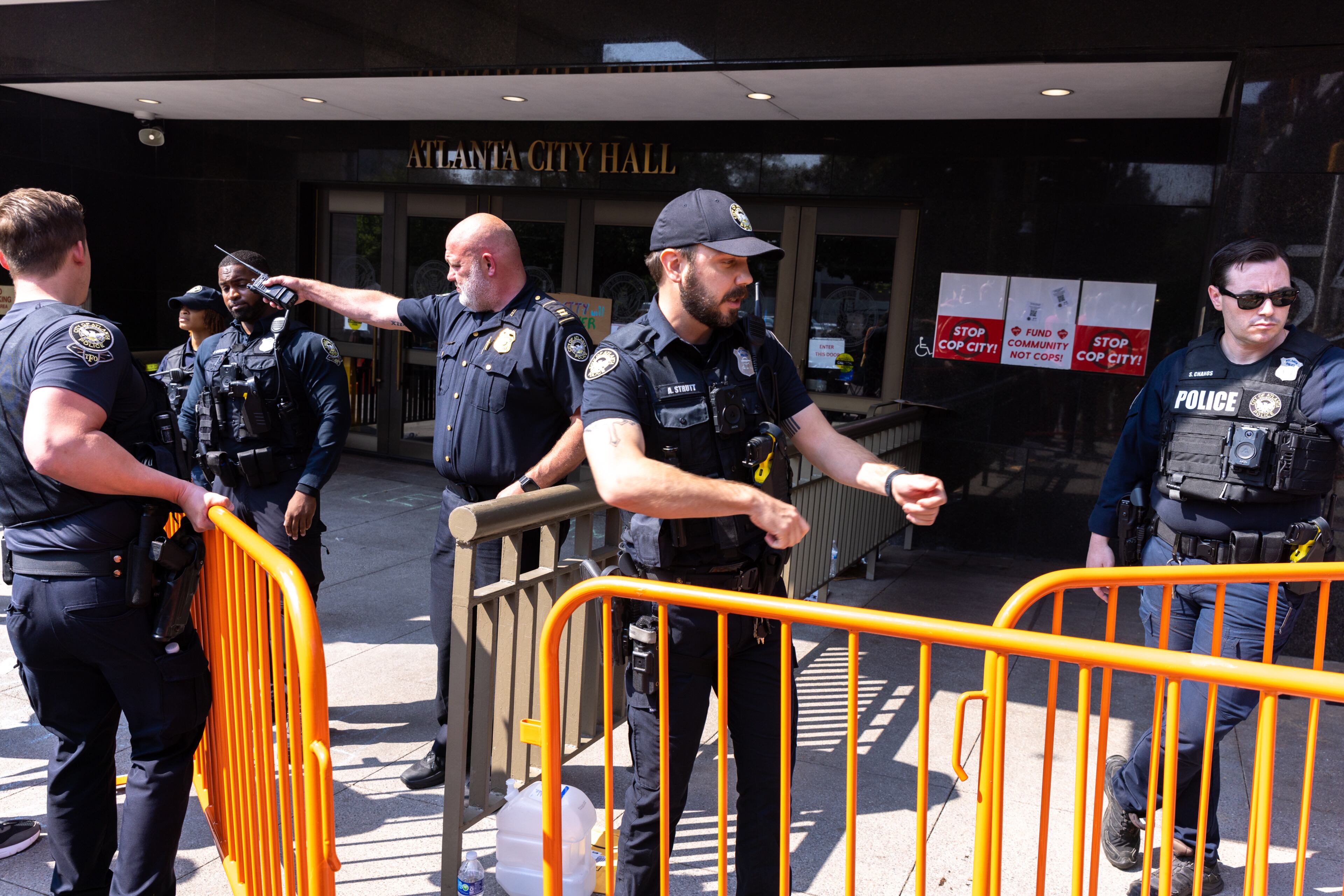Atlanta police officers set barricades in front of City Hall as council members are expected to vote on legislation that funds construction of the planned training center in DeKalb County on June 5, 2023. (Arvin Temkar/arvin.temkar@ajc.com)