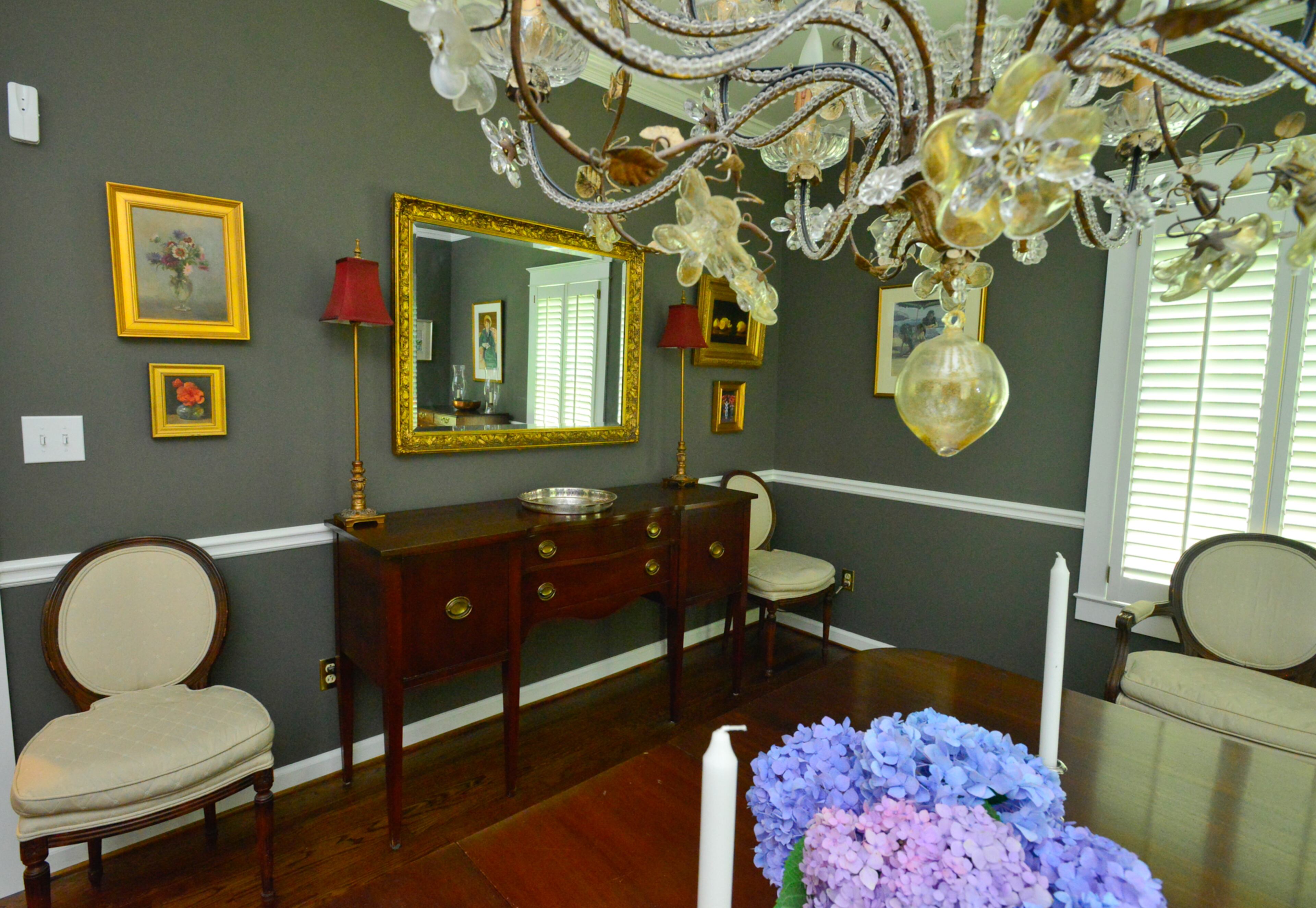 Some people think the Italian hand-blown glass chandelier is tacky, but Lisa Gleim-Jonas doesn't mind. "Everybody hates my light fixture. I love my gaudy chandelier," she said. "I see it more as a piece of art." The dining room table belonged to Lisa Gleim-Jonas' grandmother, and the buffet was purchased at Scott Antique Markets. The chairs were wedding presents from husband Bill's parents.