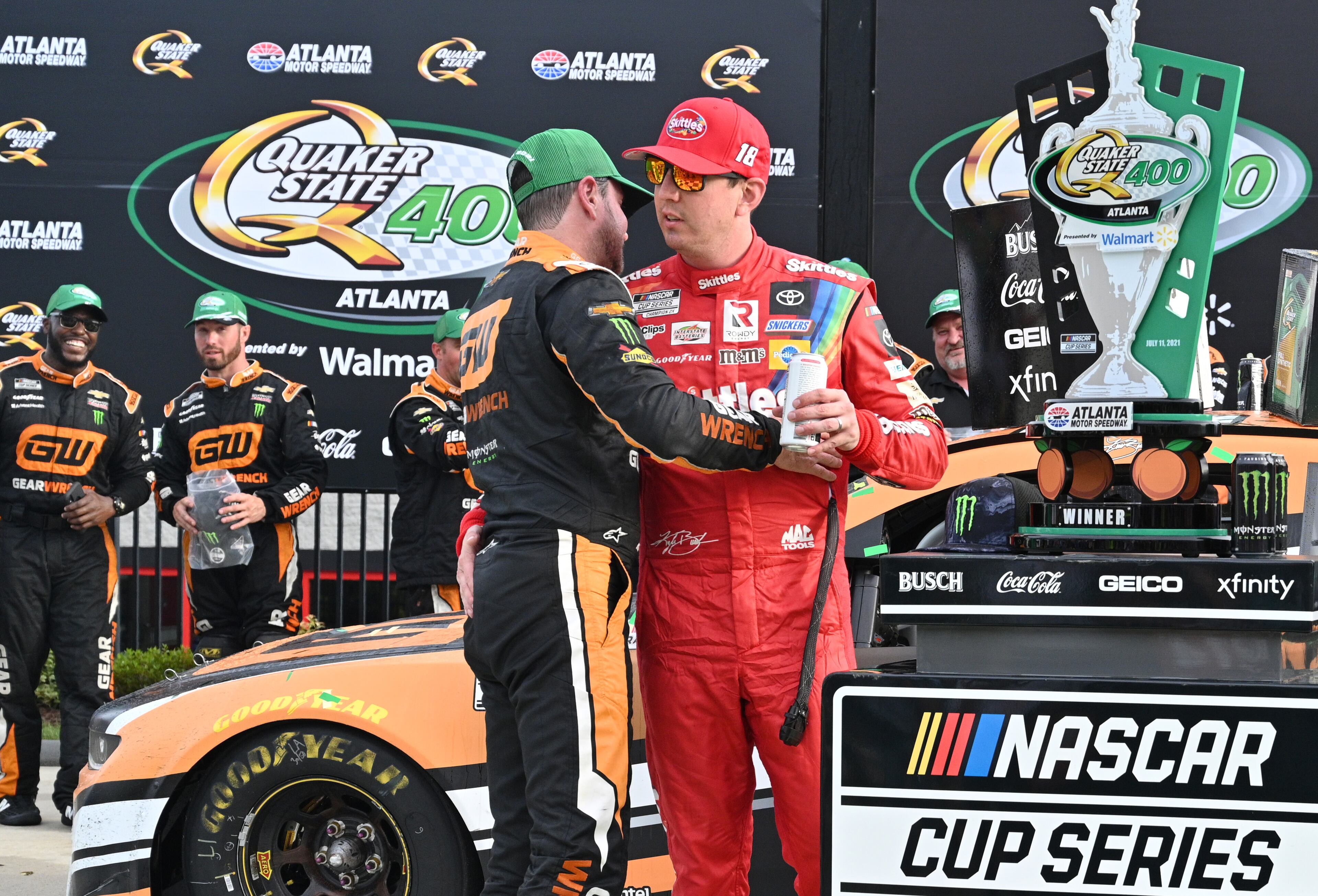 Kyle Busch (right, red) congratulates his brother, Kurt Busch, (left) on winning the Quaker State 400 Presented by Walmart Sunday, July 11, 2021, at Atlanta Motor Speedway in Hampton. Busch passed brother Kyle with 24 laps left and won the NASCAR Cup Series race Sunday to complete a sibling weekend Atlanta sweep. (Hyosub Shin / Hyosub.Shin@ajc.com)