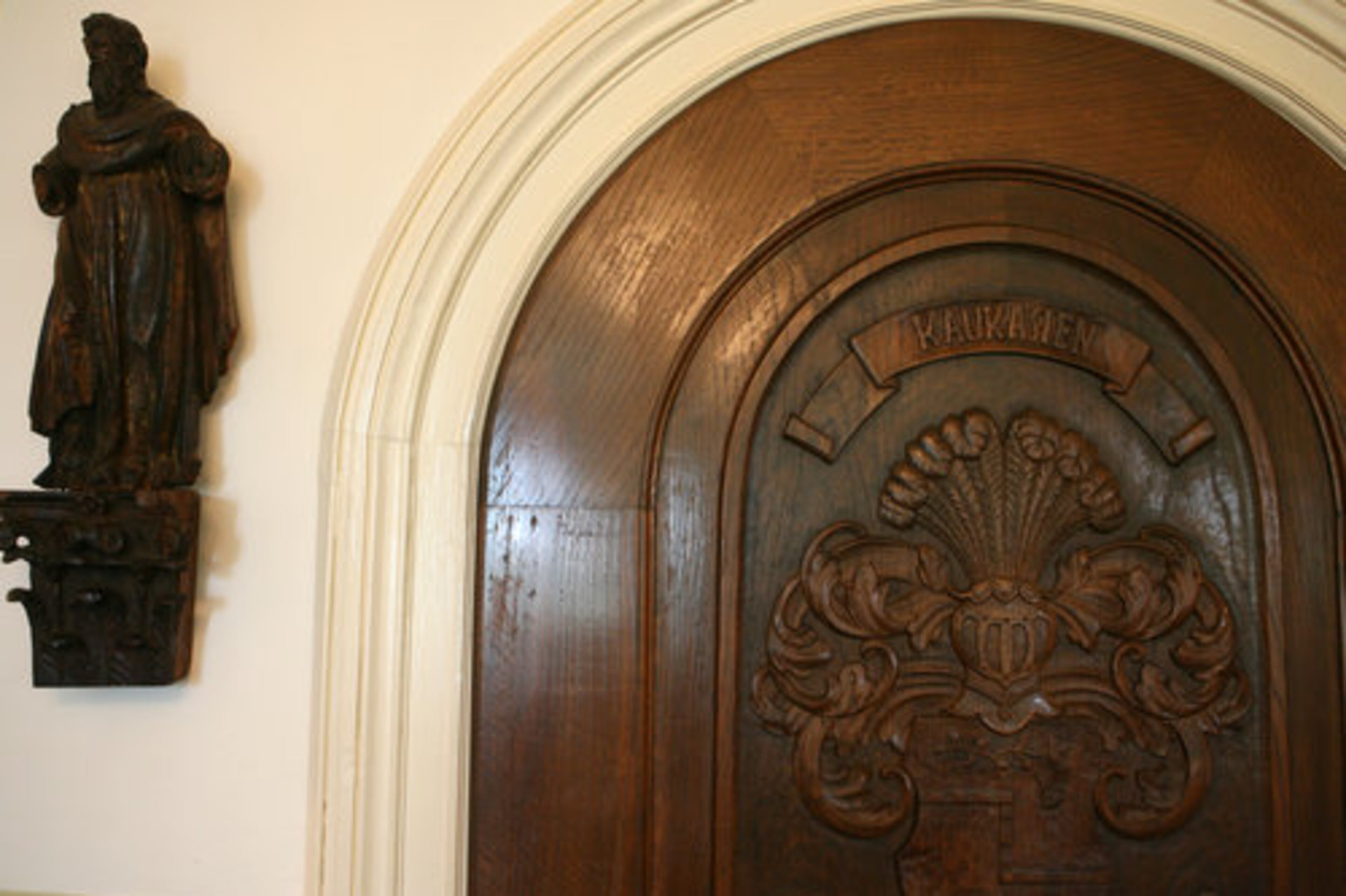 The Kauka family crest adorns this heavy wooden door on the library. The Kaukas imported this and several other doors from their German homes to install at Chinquapin.