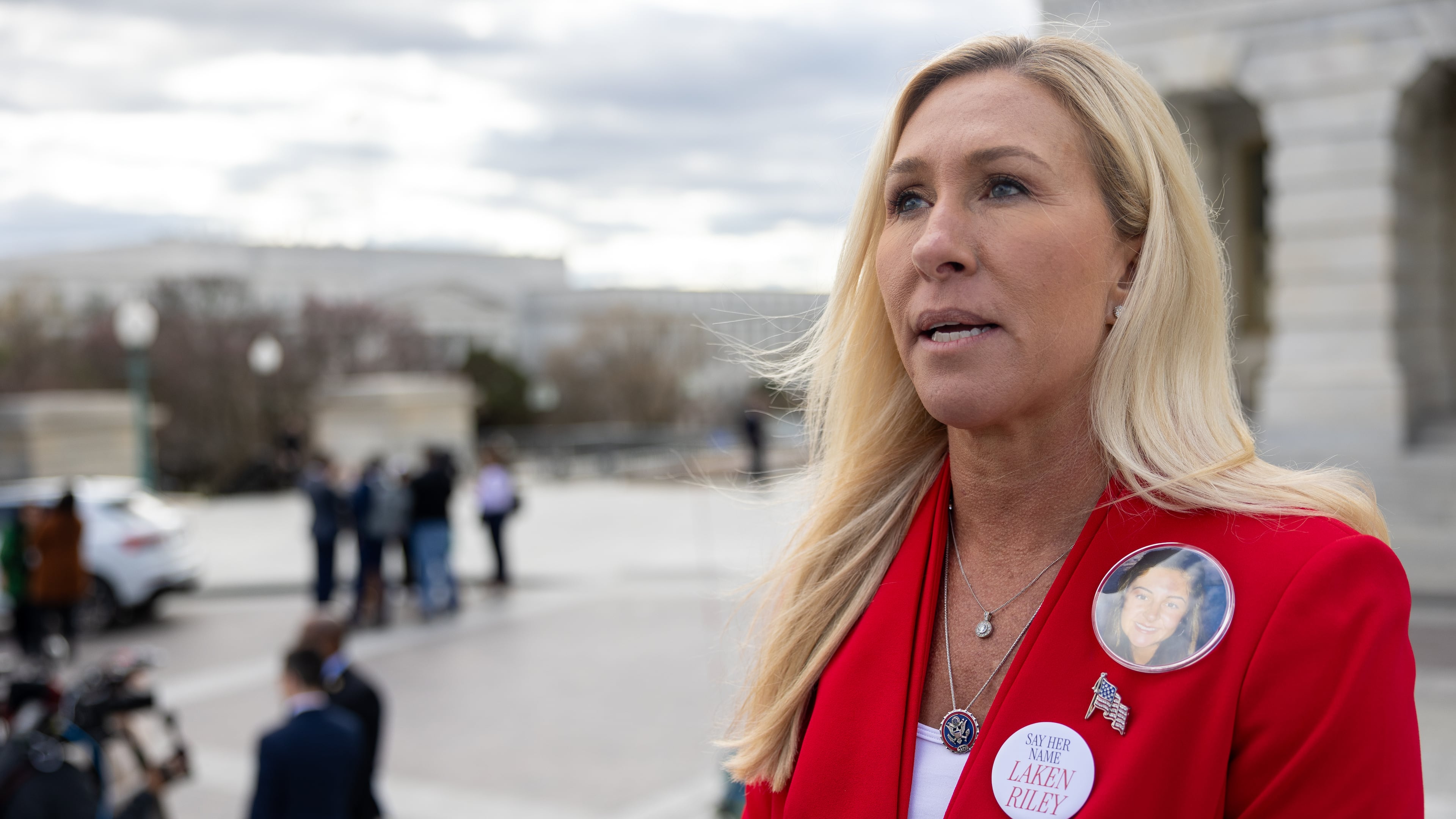 U.S. Rep. Marjorie Taylor Greene speaks to the press in Washington, D.C., as she wears pins memorializing Laken Riley in this file photo from 2024. President Donald Trump has endorsed former prosecutor Clay Fuller in Tuesday's special election in Georgia's 14th District. Voters will decide how much the presidential nod matters. (Nathan Posner for the AJC 2024)