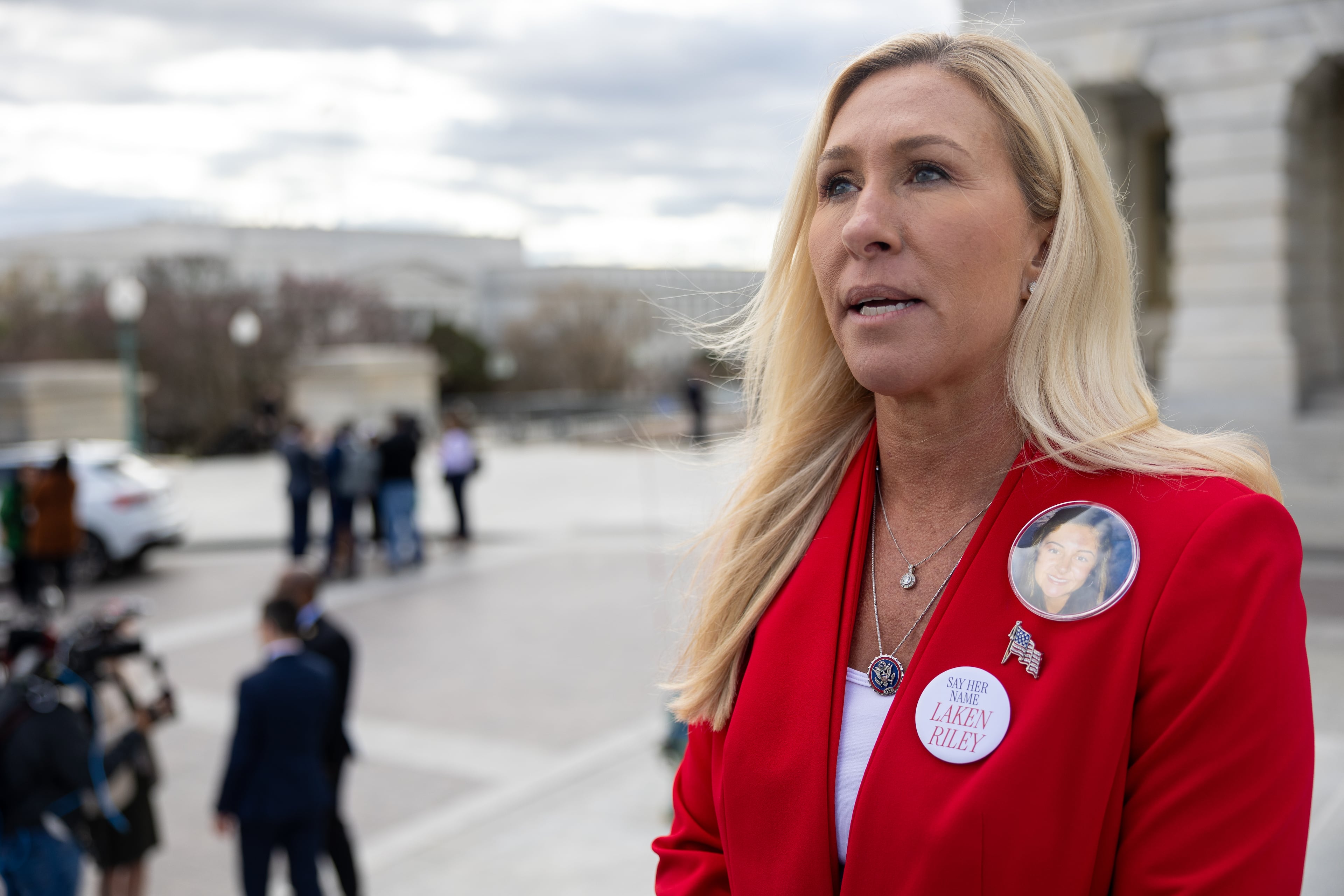 U.S. Rep. Marjorie Taylor Greene speaks to the press in Washington, D.C., as she wears pins memorializing Laken Riley in this file photo from 2024. President Donald Trump has endorsed former prosecutor Clay Fuller in Tuesday's special election in Georgia's 14th District. Voters will decide how much the presidential nod matters. (Nathan Posner for the AJC 2024)