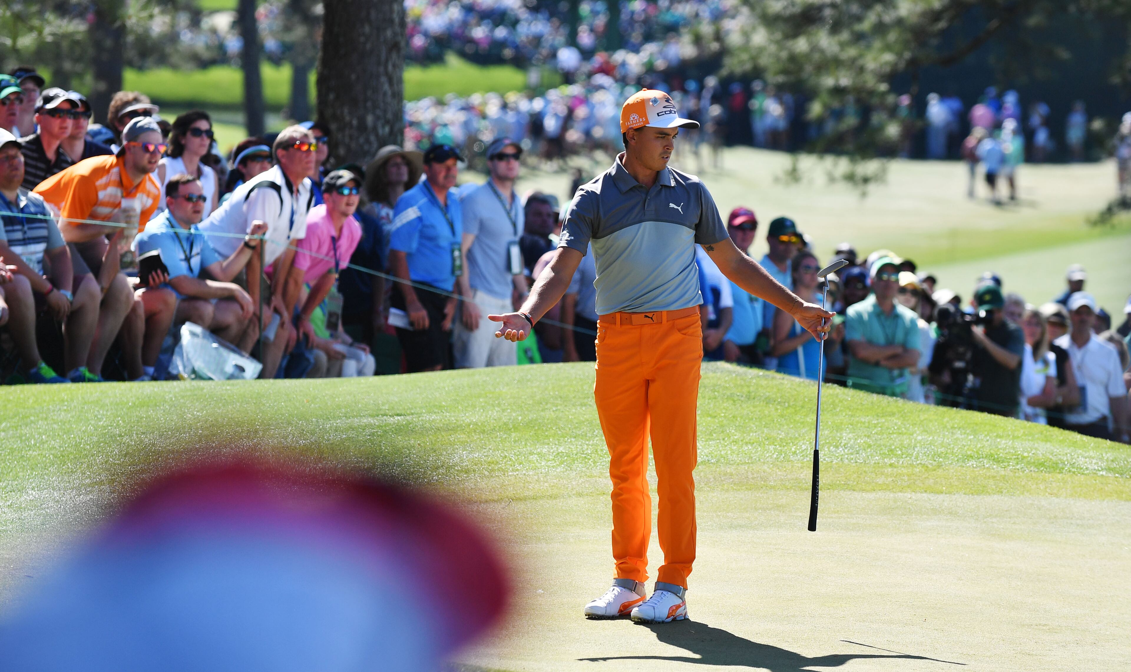 Rickie Fowler reacts to his par putt on the 7th green.