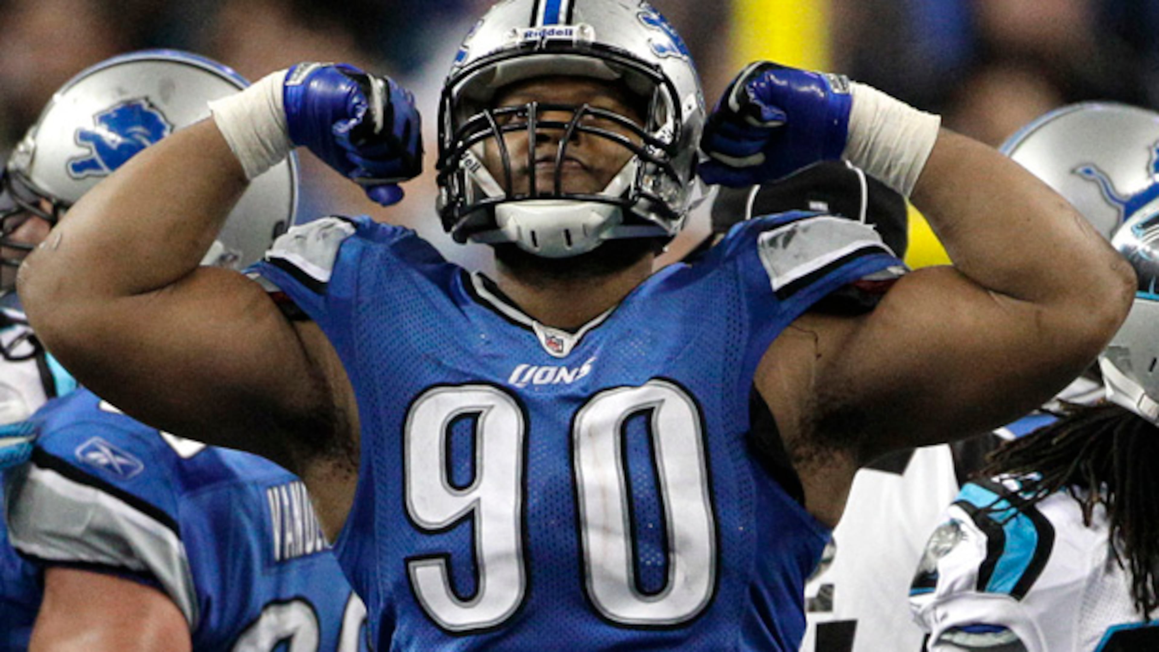 Detroit Lions defensive tackle Ndamukong Suh (90) celebrates a stop against the Carolina Panthers in the fourth quarter of an NFL football game in Detroit, Sunday, Nov. 20, 2011. (AP Photo/Paul Sancya) Ndamukong Suh will command one of the NFL's richest contracts, but likely not from Falcons. (AJC)